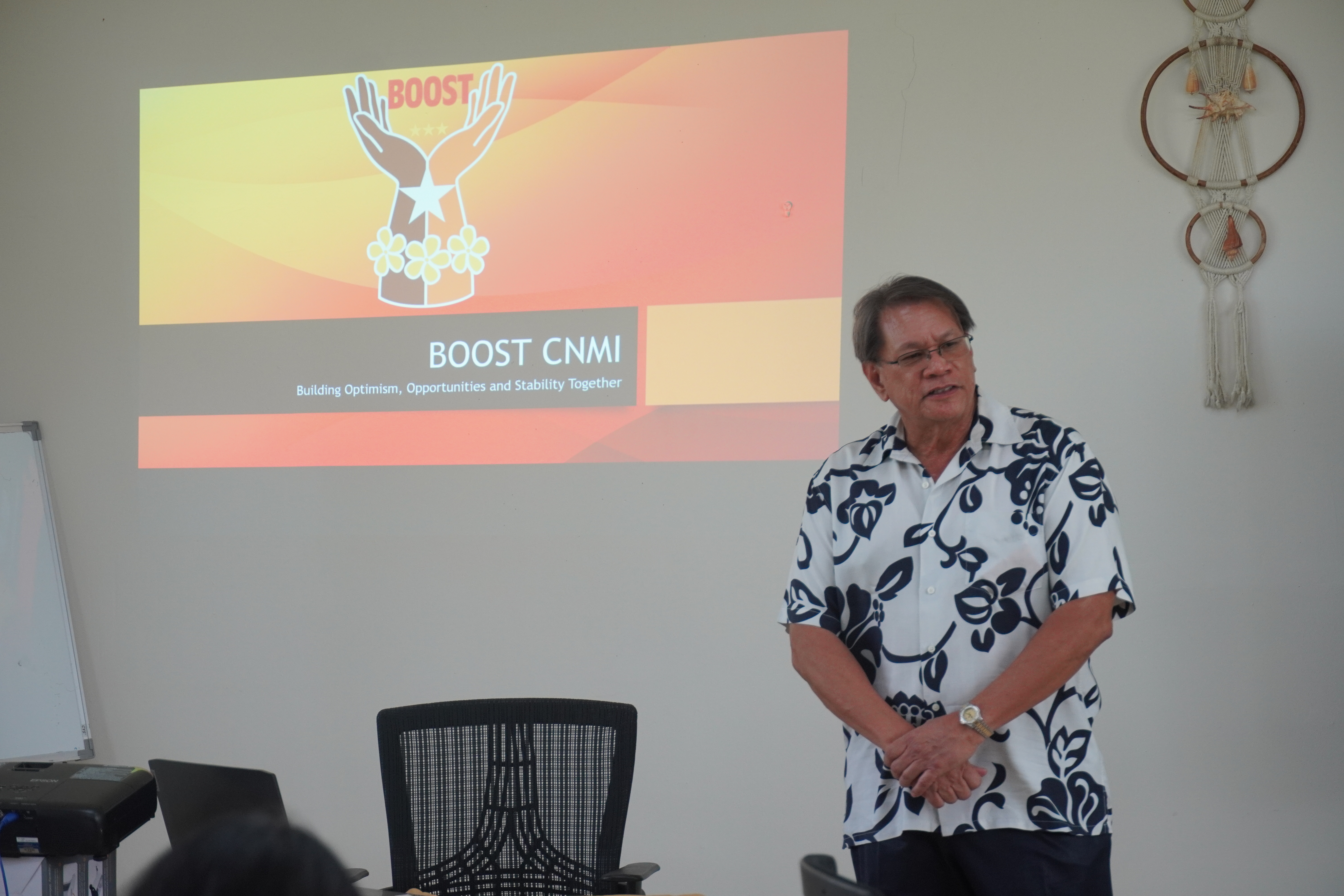 BOOST Program grant administrator and Bank of Saipan President/CEO John Arroyo presents information about the grant to a cohort of women entrepreneurs Wednesday at the CNMI Women's Association office on Capital Hill.