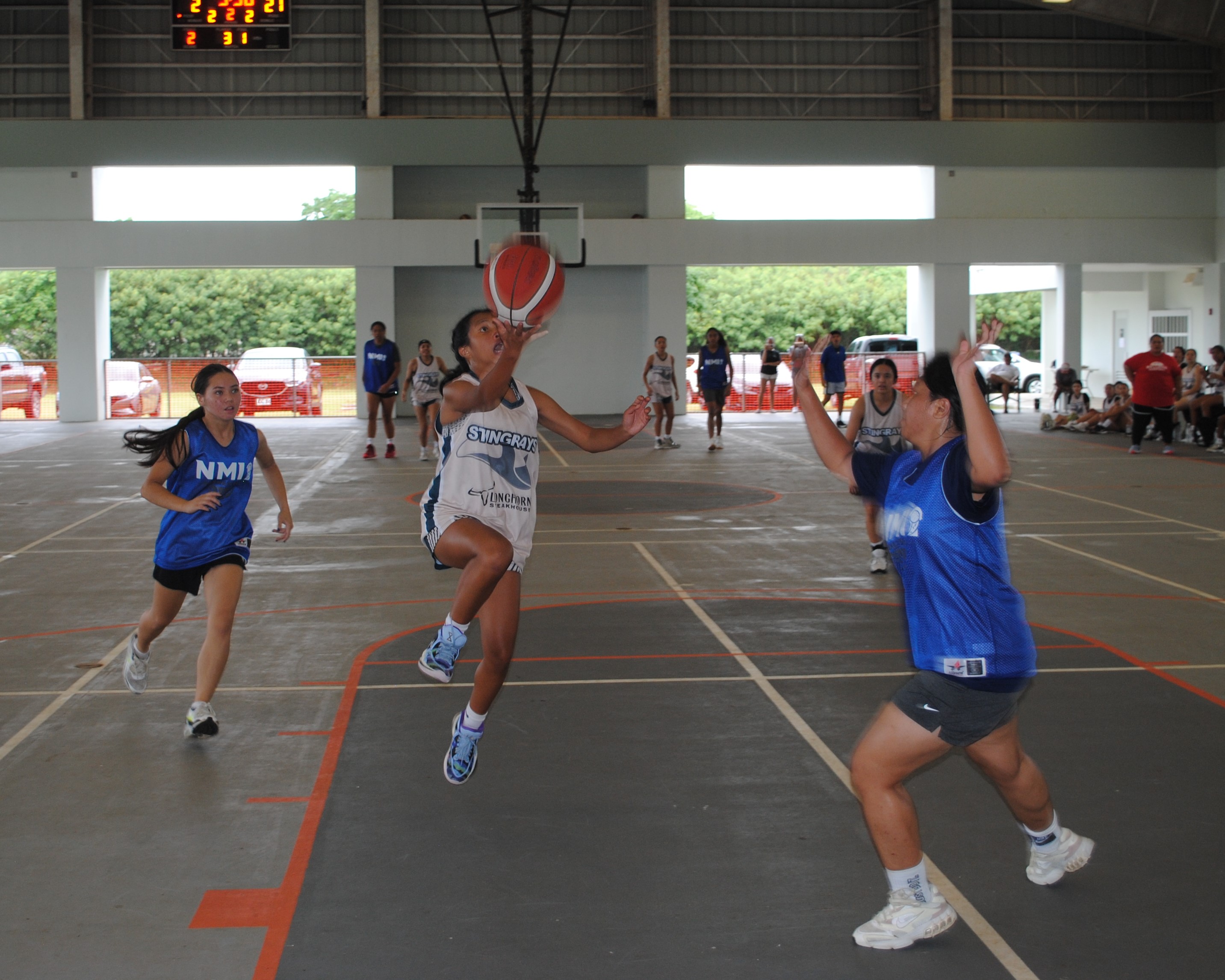 Guam's Jordin Hernandez extends for the layup.