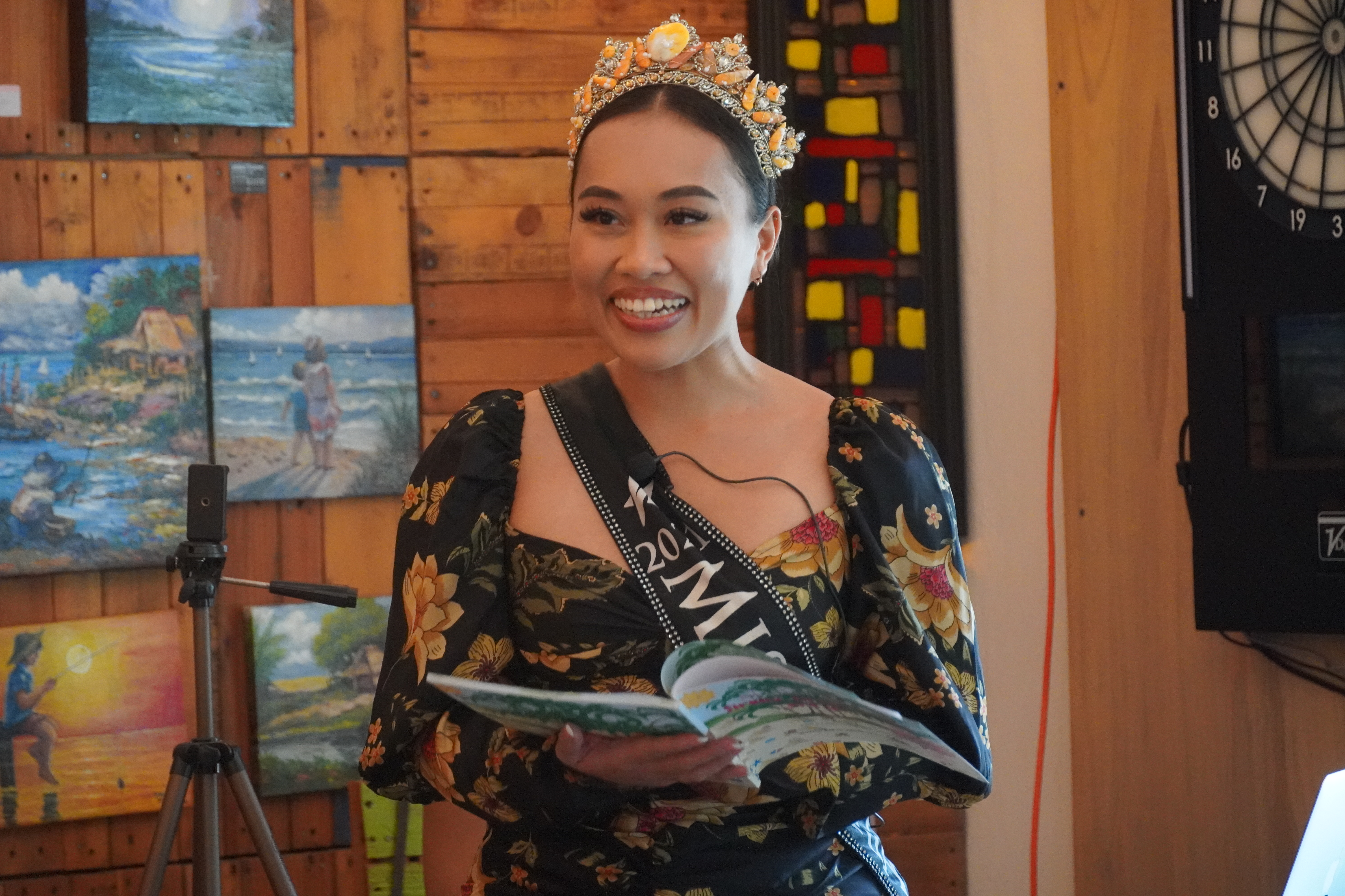 2021 Miss Marianas Savannah Delos Santos reads “An Island Paradise: Sirena, Sirena, Where Are You?” during a book launch at Marianas Creations.