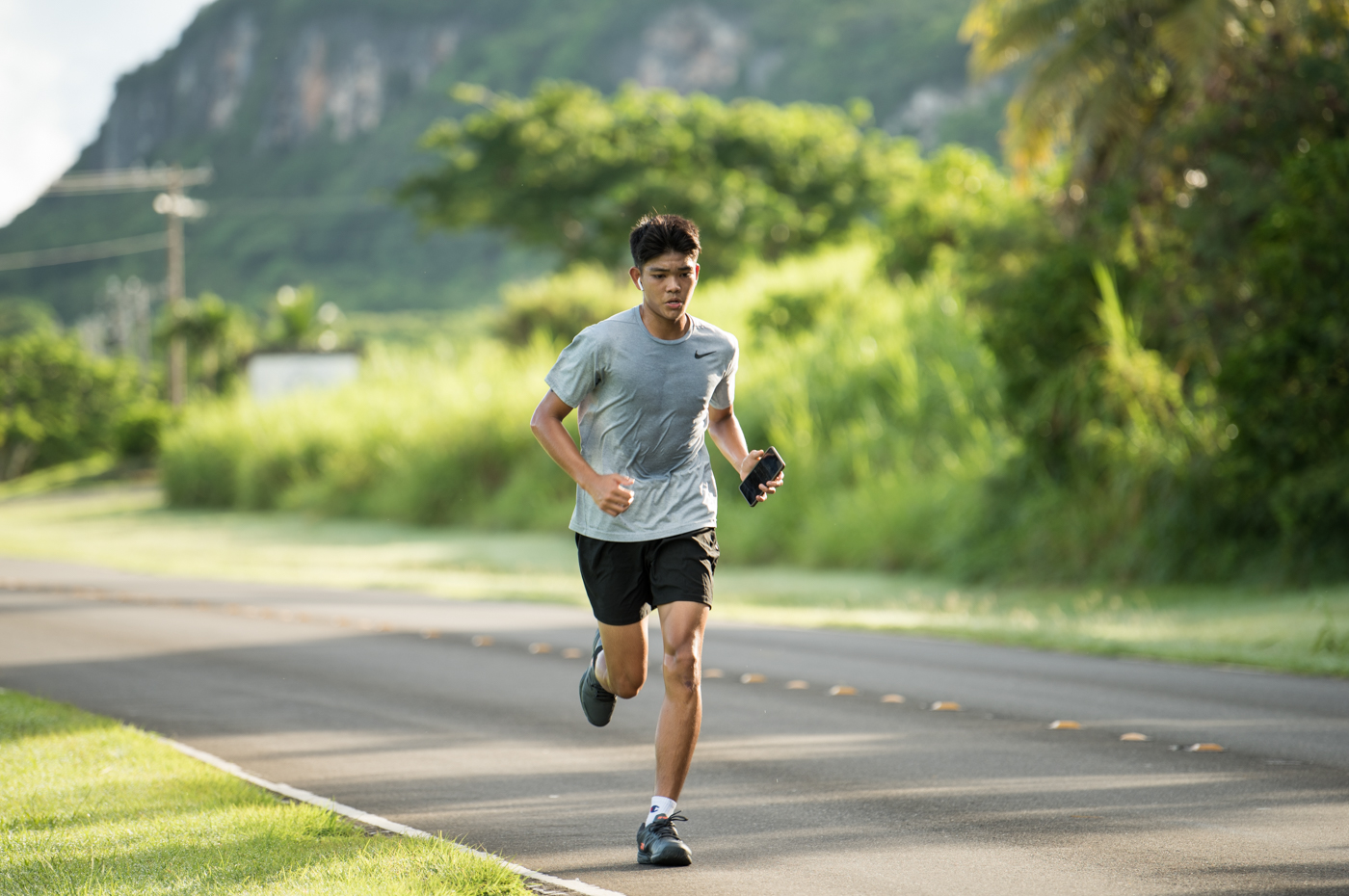 Cody Shimizu leads the running portion in the Mixed Relay category of the 50th Tan Holdings Anniversary Triathlon at Paupau Beach in San Roque on Saturday.