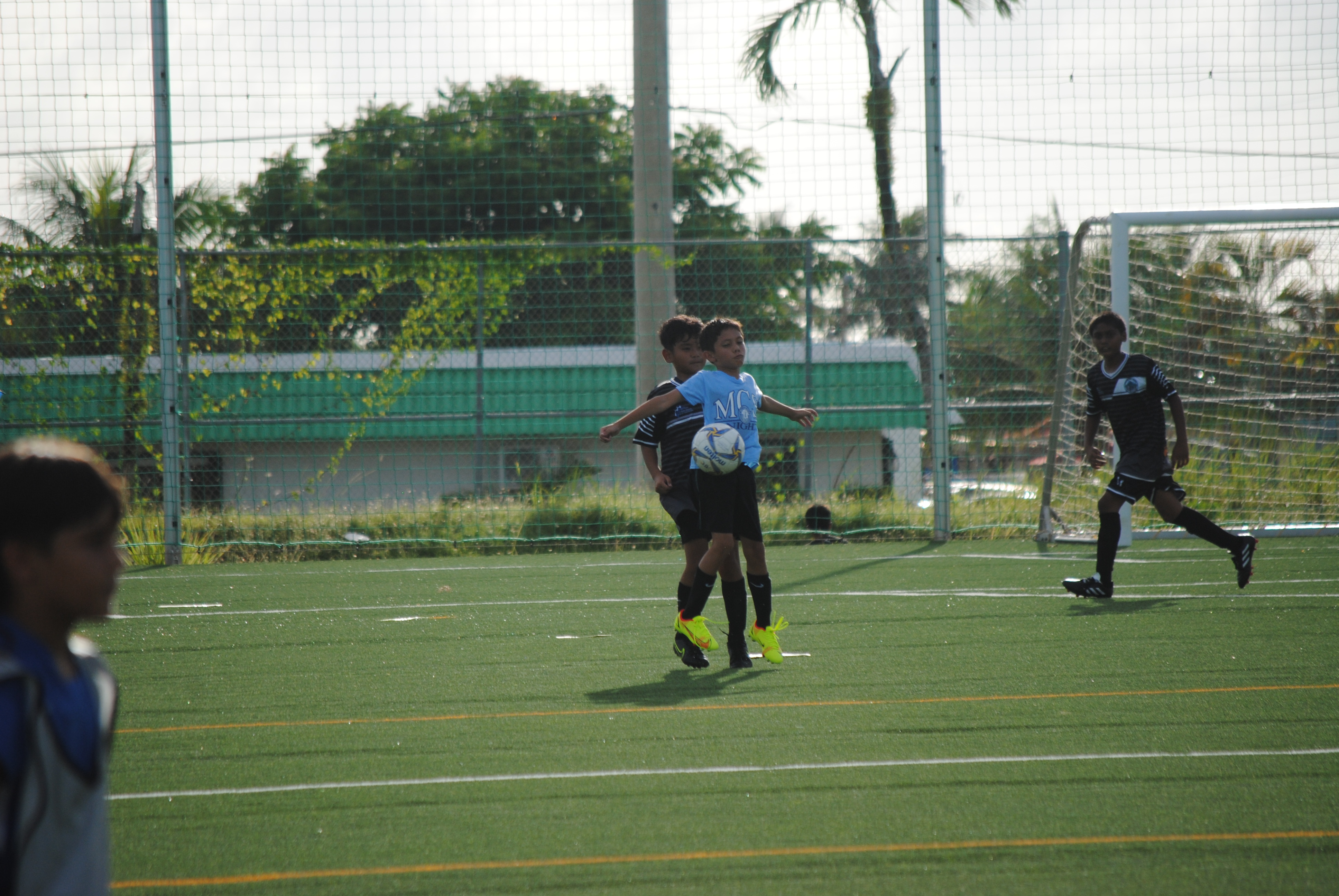An MCS 2 player attempts to control the possession using his body during an NMIFA-PSS Interscholastic Soccer League game Monday at the NMI Soccer Training Center.
