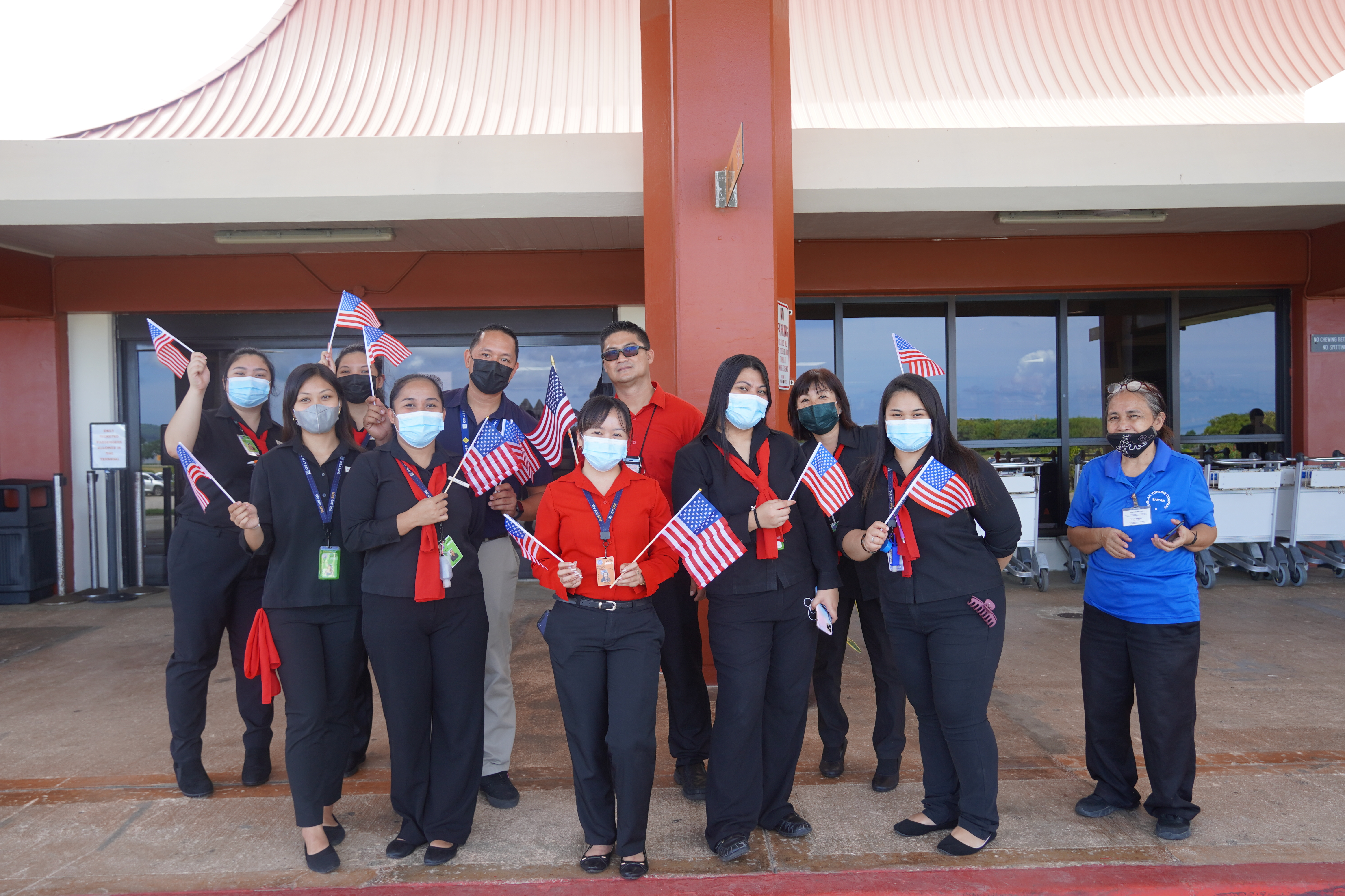 United Airlines agents pose for a photo on Saturday morning.
