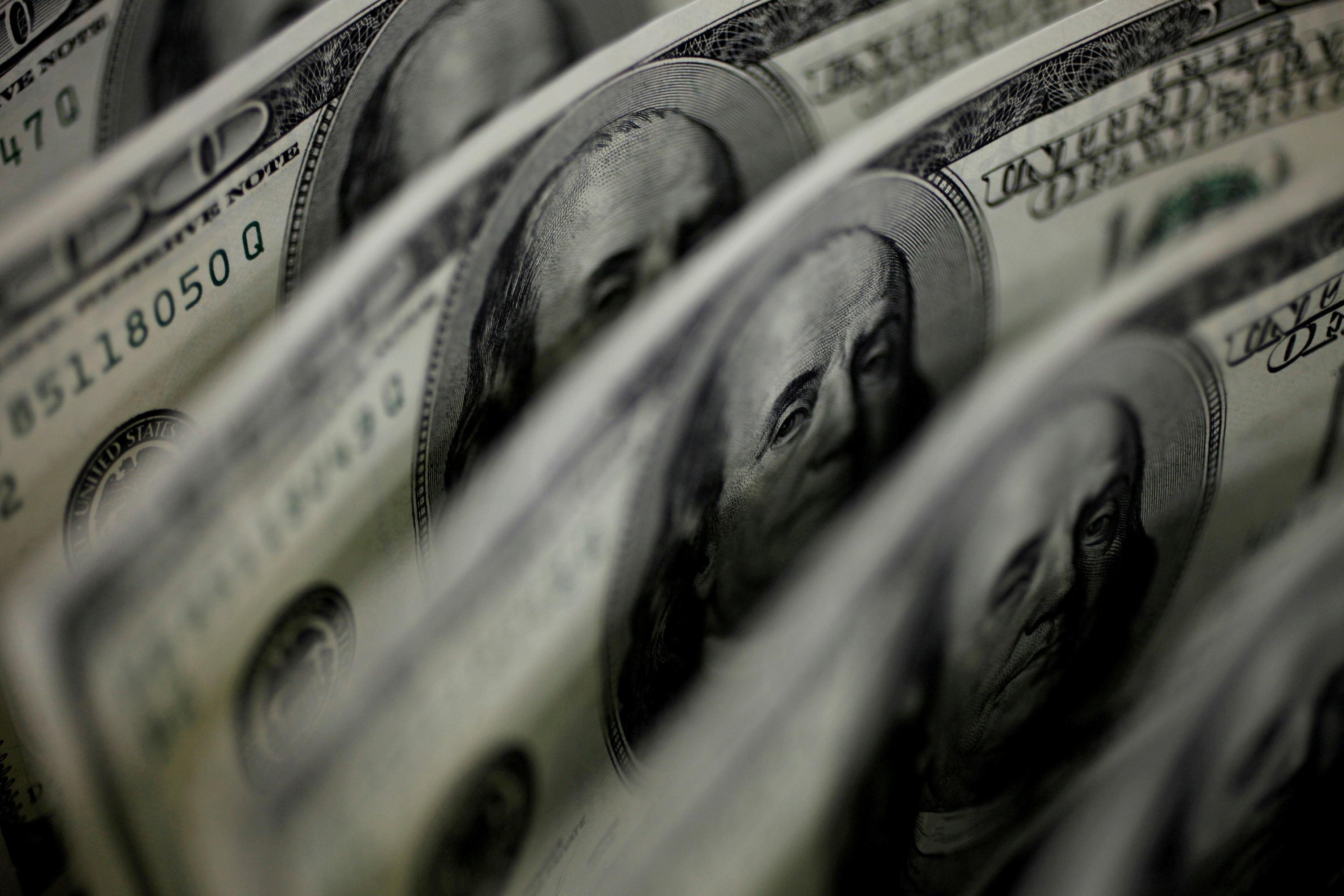 A picture illustration shows 100-dollar bank notes taken in Tokyo on Aug. 2, 2011.