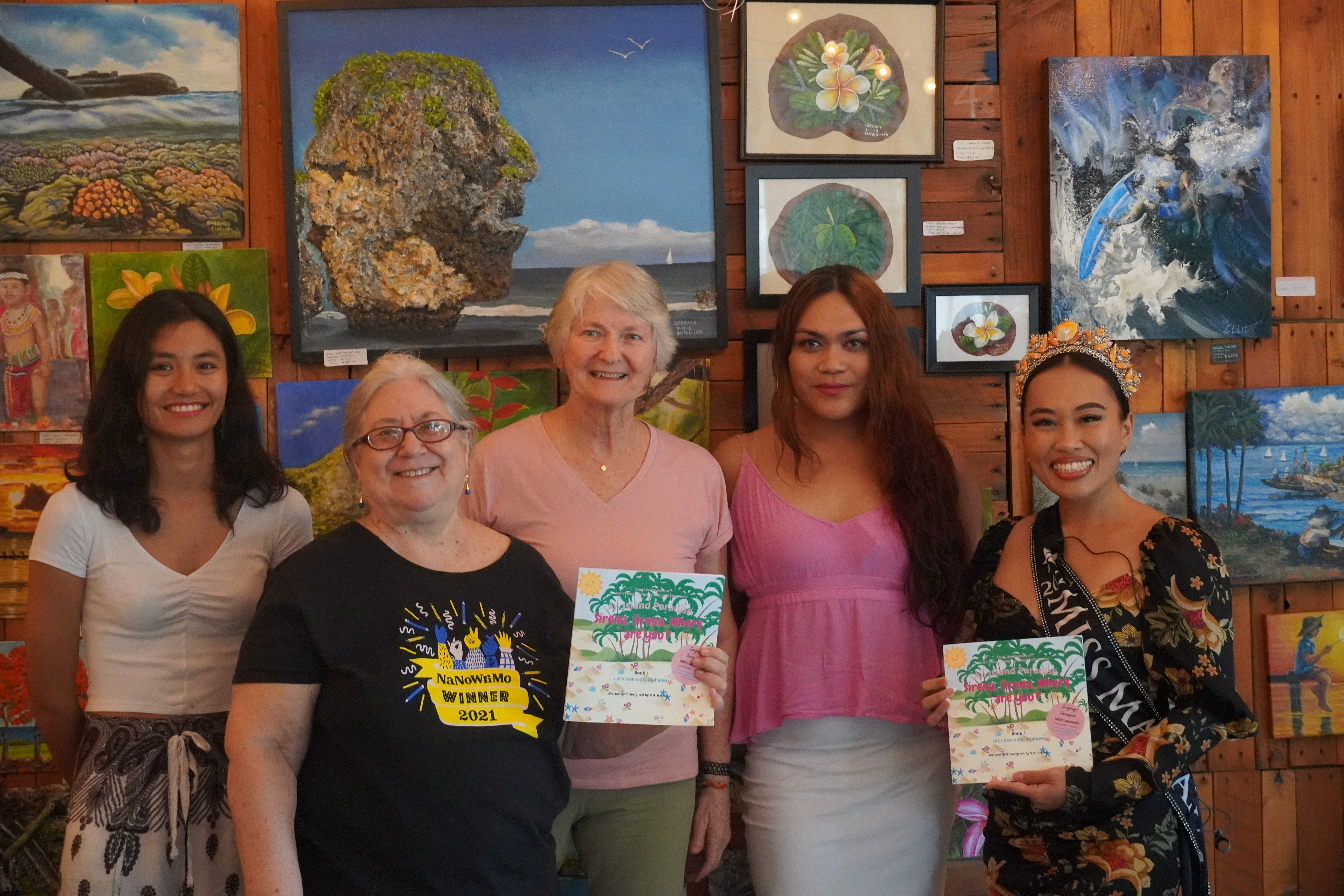 Author Valentina Rivera, second right, poses for a photo with Marianas Creations owner Elina Gharti Chhetri, 2021 Miss Marianas Savannah Delos Santos, and two community members who were present for the book reading on Saturday.
