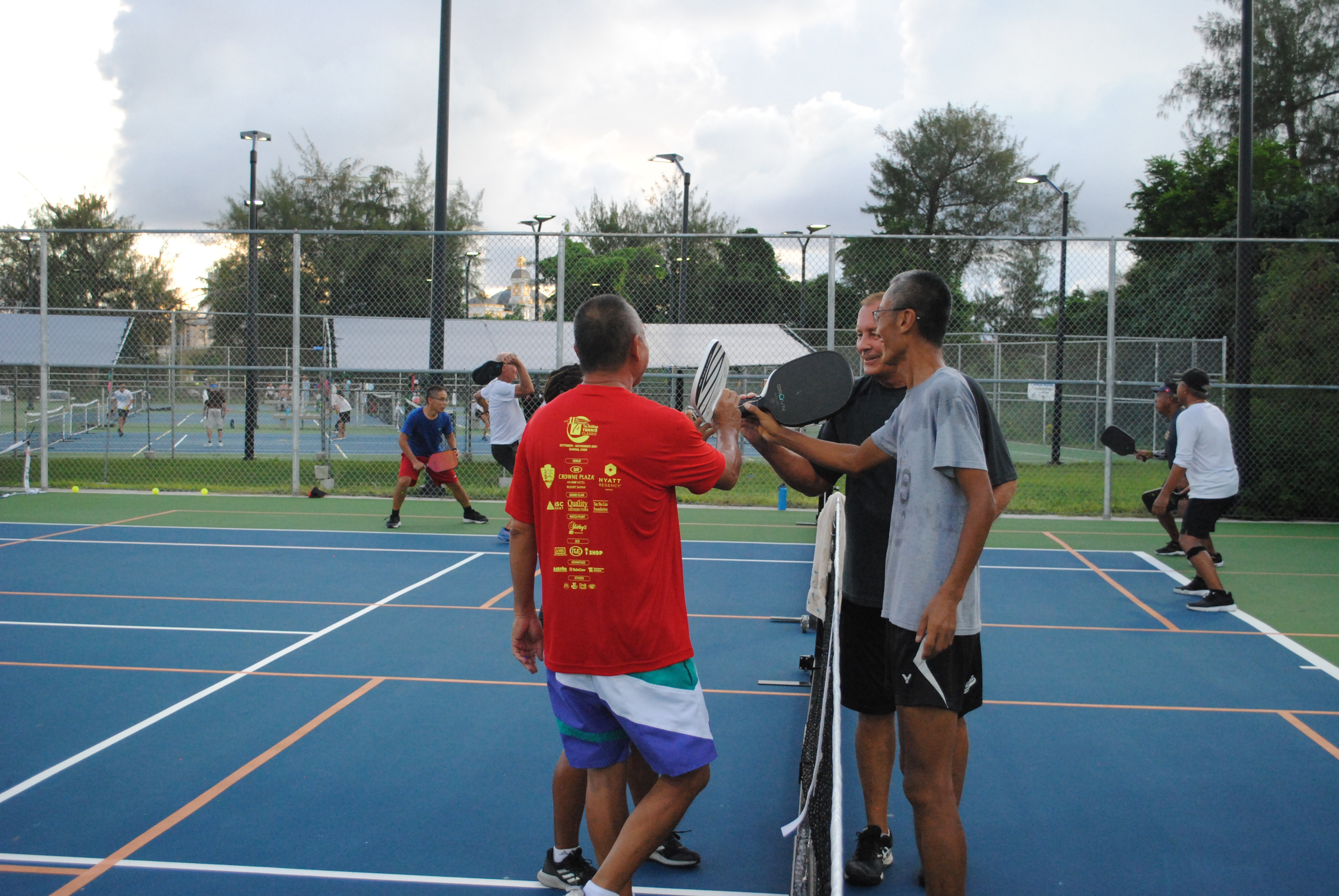 Players shake hands after their match.