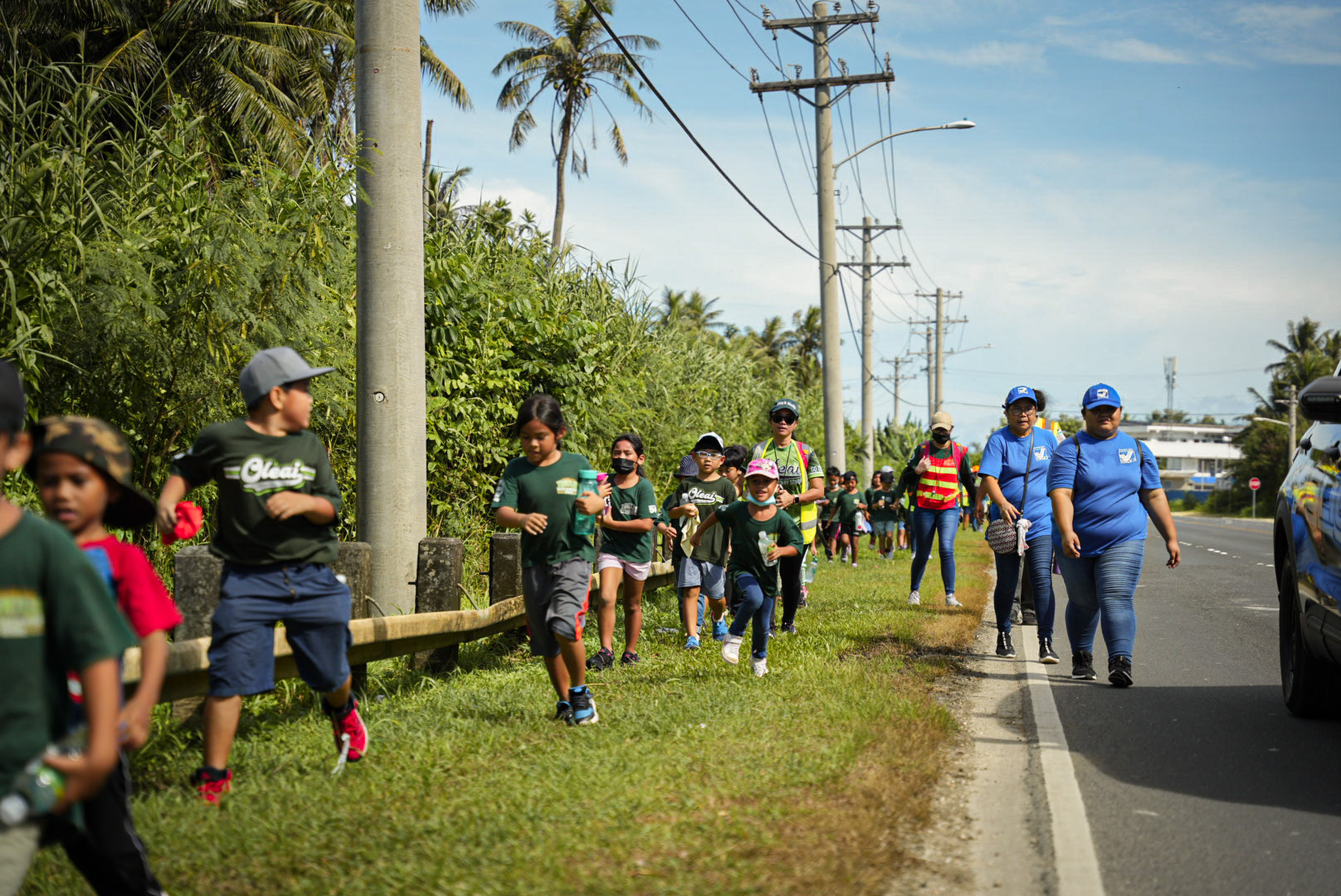With OES personnel, students head to their designated evacuation zone on As Terlaje hill.
