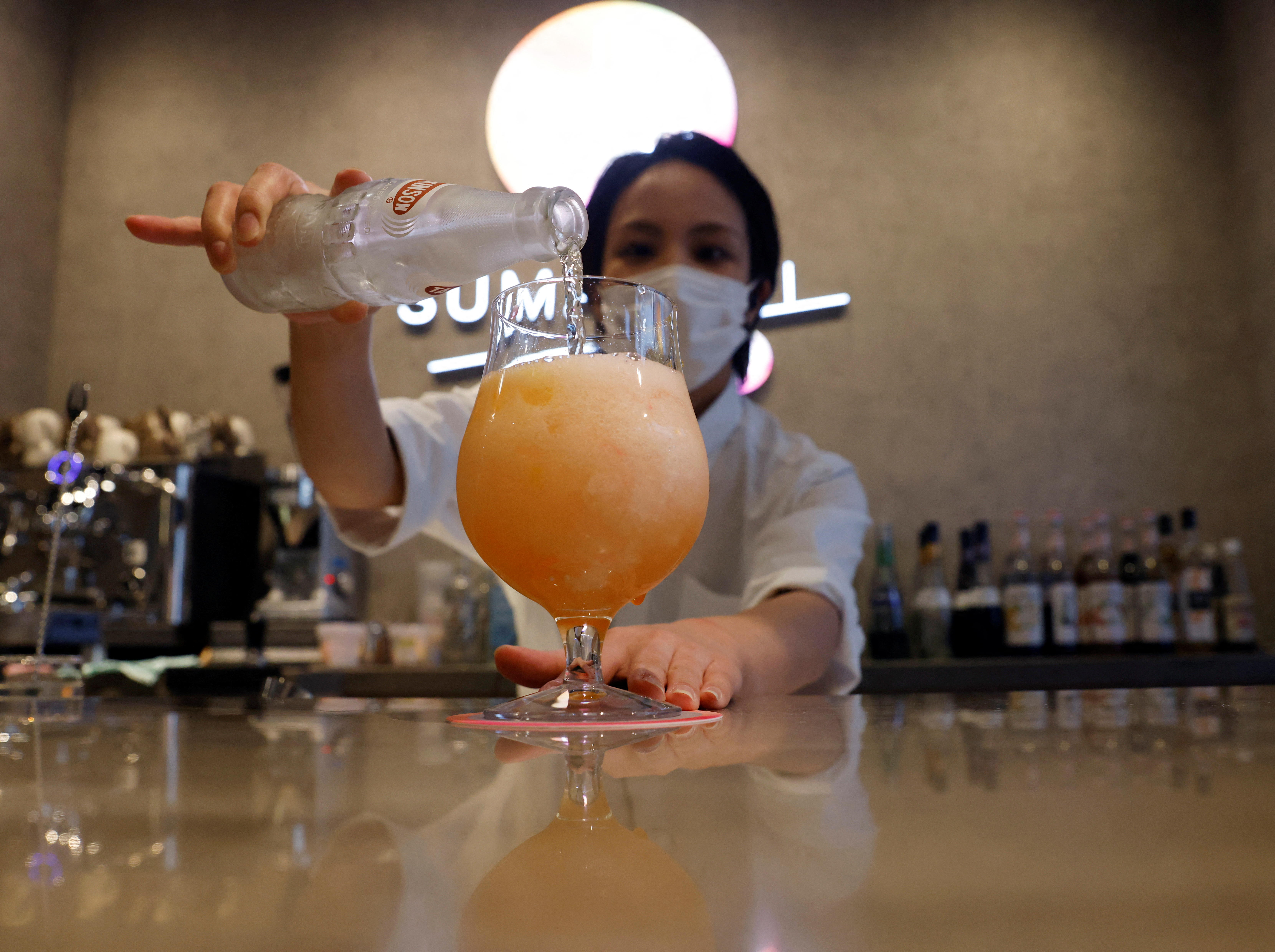 A staff member makes a cocktail with no alcohol during a photo opportunity at Sumadori Bar in Tokyo, Japan on Sept. 2, 2022.