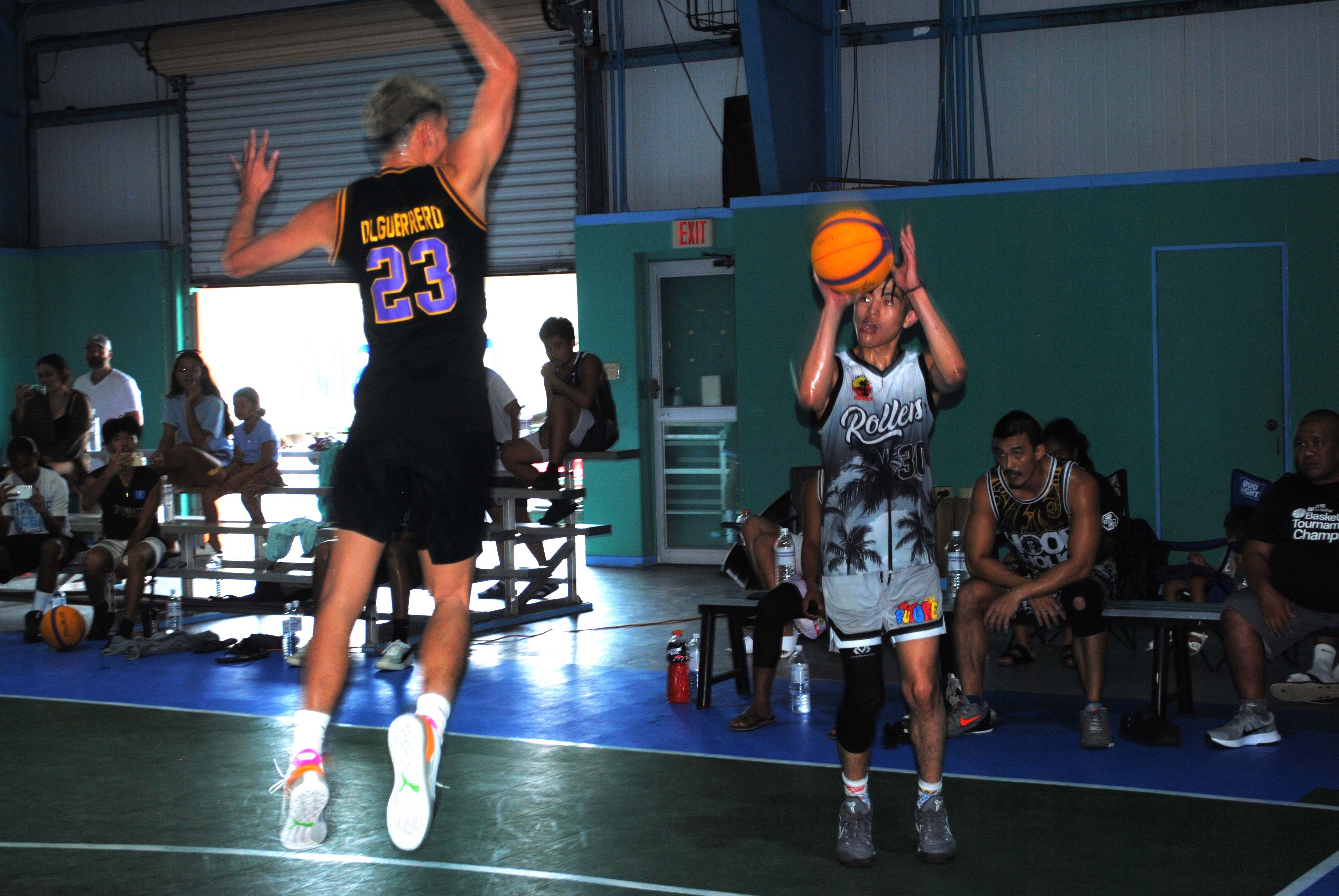 Steve King pulls up for the contested 3-point shot.