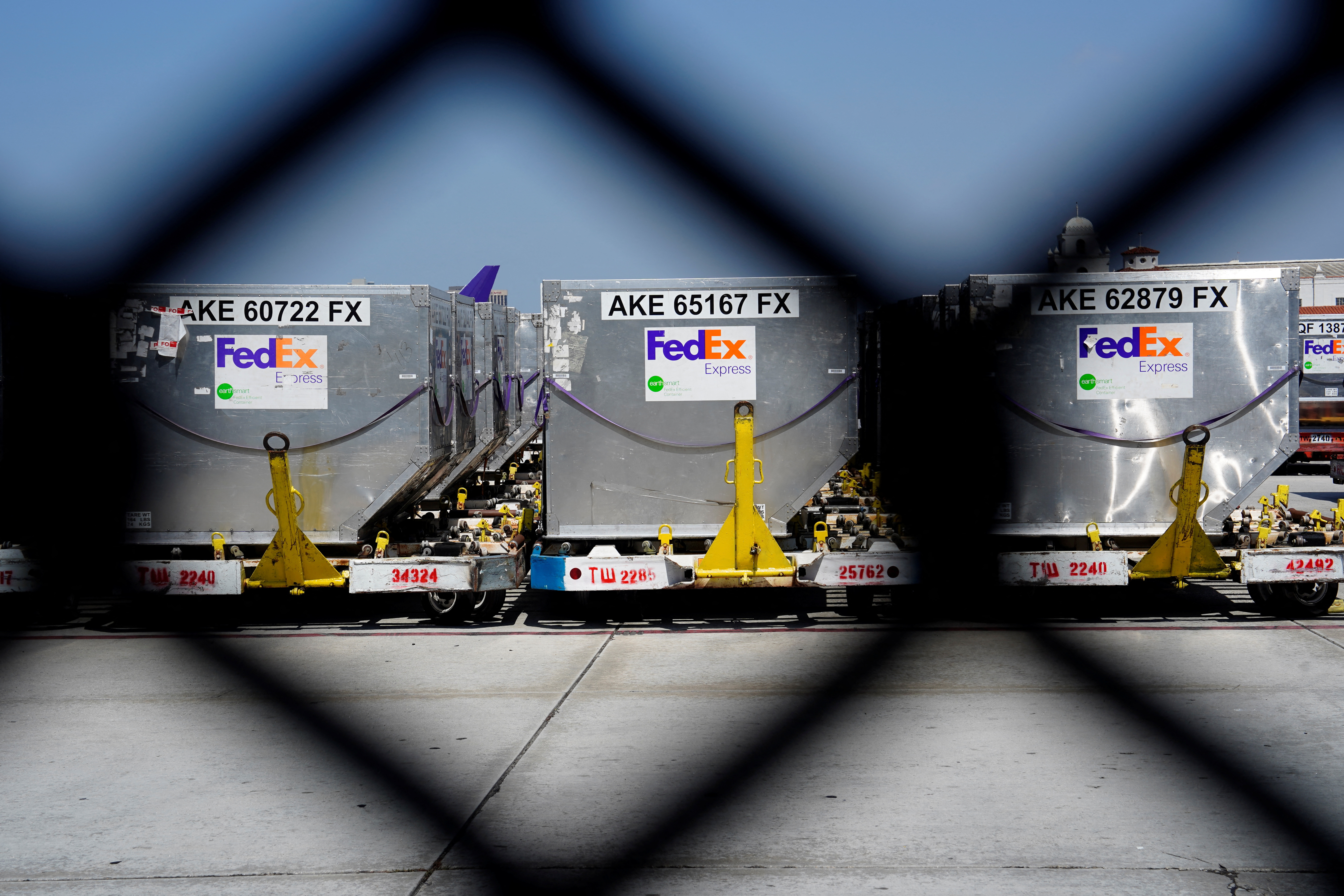 FedEx Express air freight containers, viewed through a fence at a FedEx regional hub at Los Angeles International Airport in Los Angeles, California, Sept. 16, 2022.