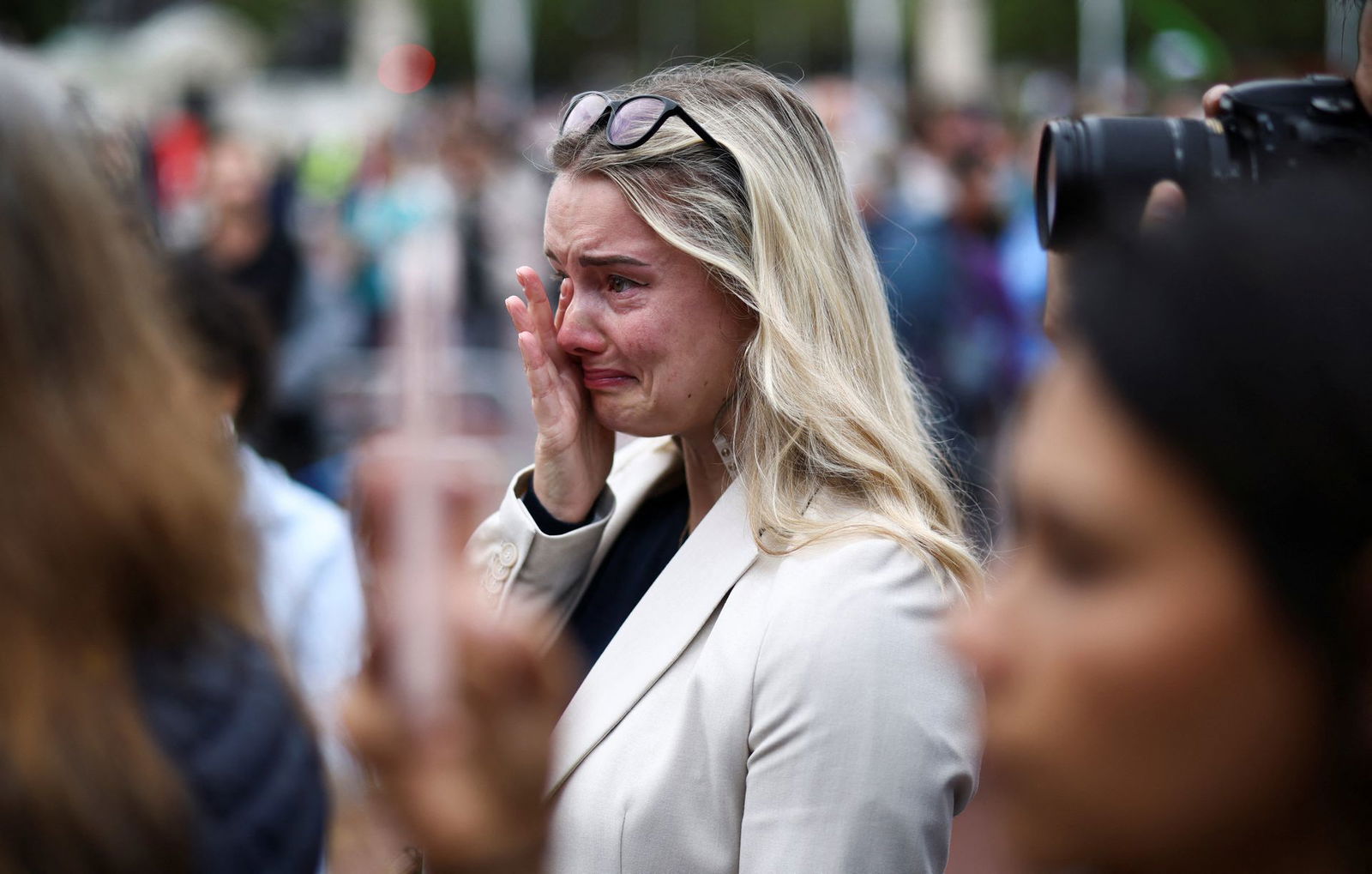 A woman reacts near Buckingham Palace, following the passing of Queen Elizabeth, in London, Britain, Sept. 9, 2022.