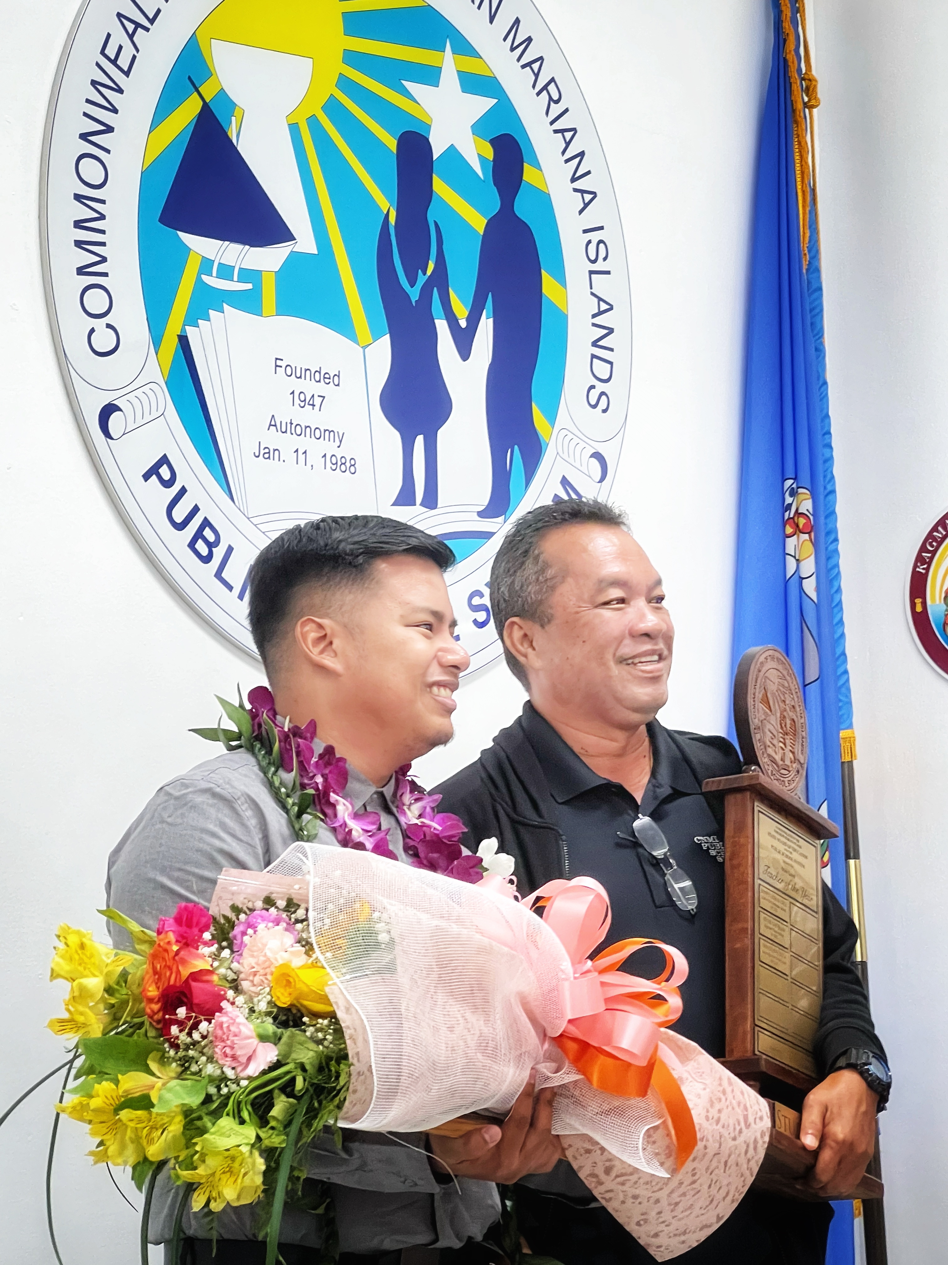 2023 PSS Teacher of the Year Donovan M. Tudela with SSHS Principal Vince Dela Cruz who is holding the perpetual trophy.