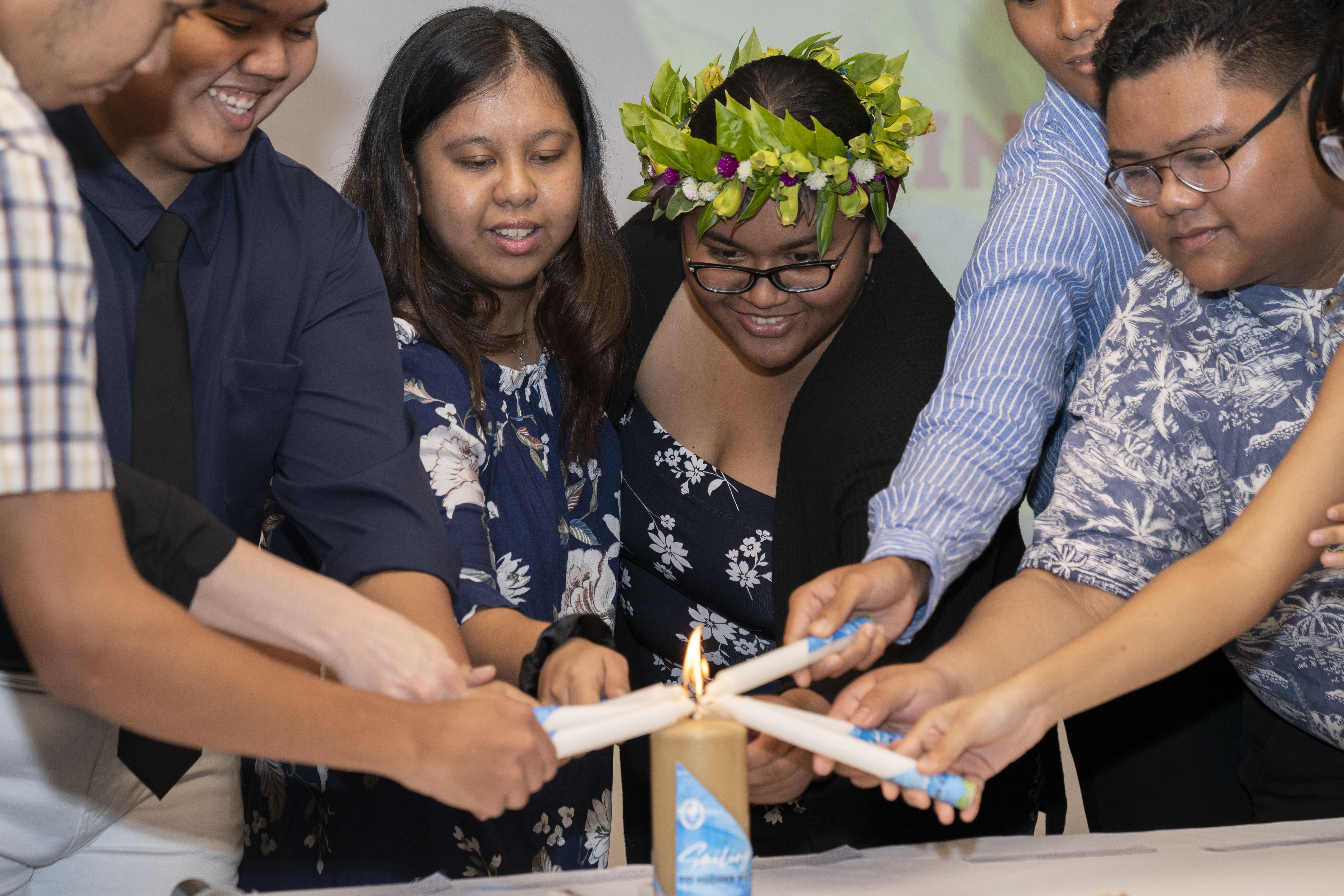 Northern Marianas College's new student officers light the Associated Students of NMC leadership candle during their investiture ceremony Friday, Sept. 23, at the Pacific Islands Club. The lighting of the candle symbolizes the unity and trust bestowed upon the new officers.
