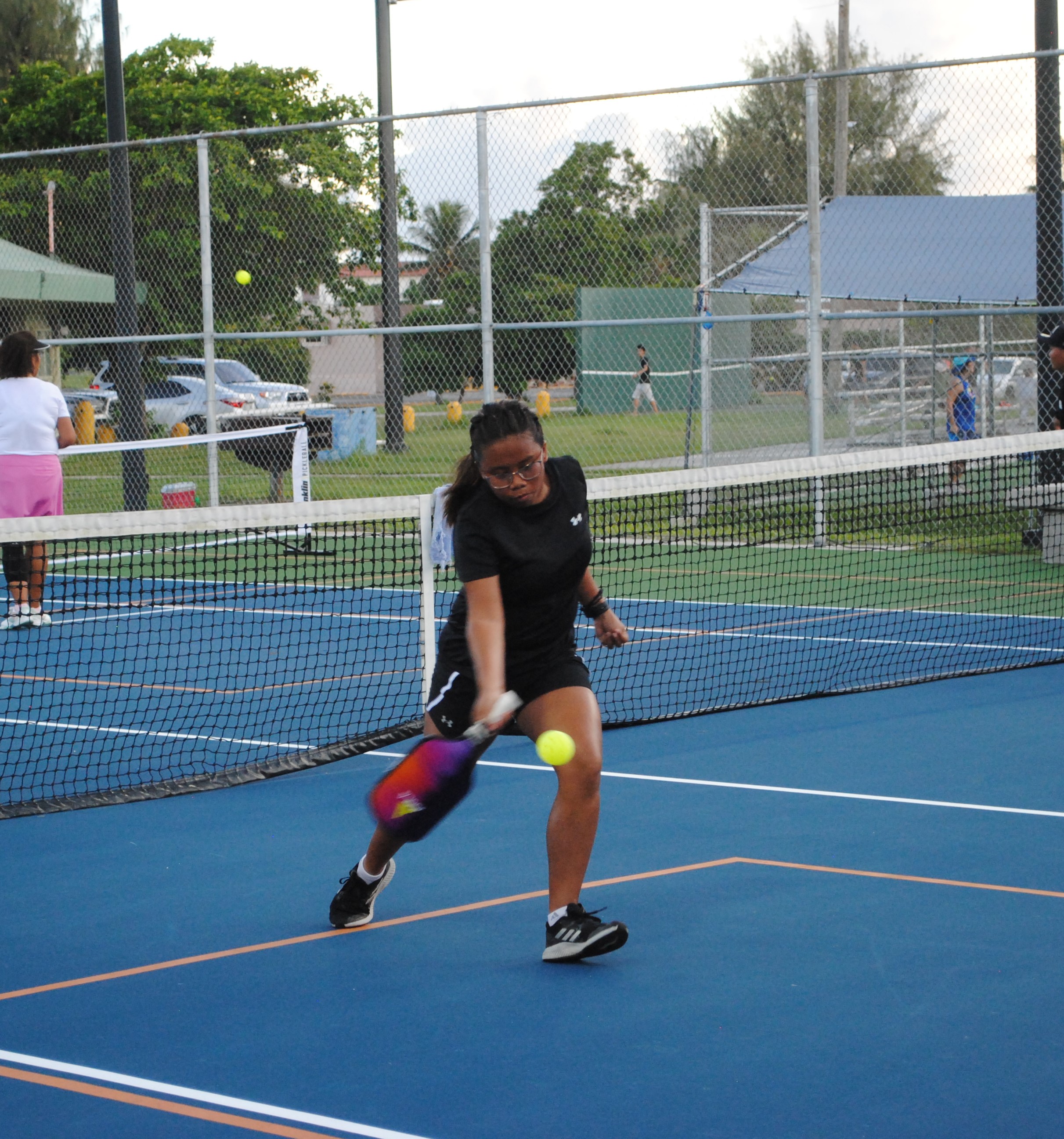 Elisha Chelsea Herzon extends for the forehand return during a pickleball match Saturday at American Memorial Park.