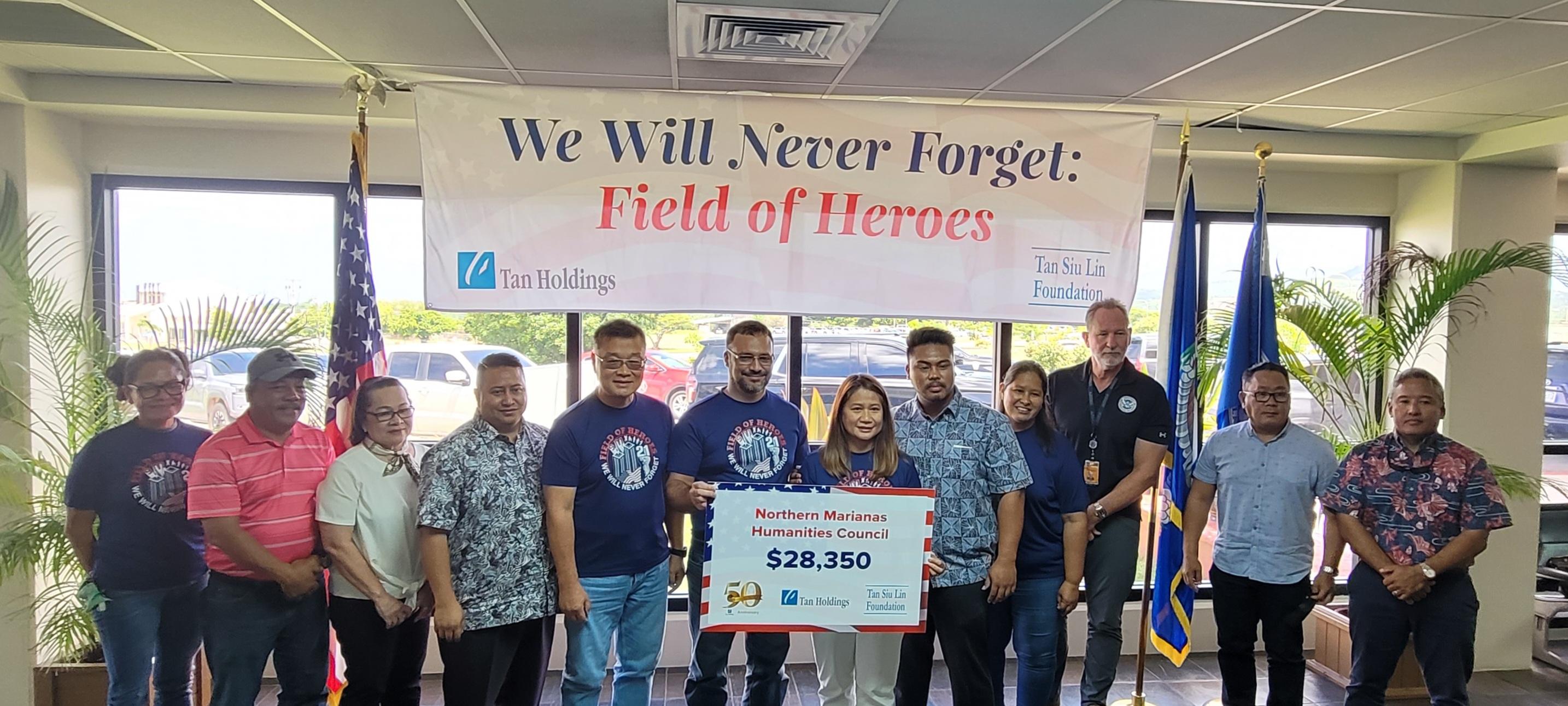 Posing for a photo in the departure lobby of the Francisco C. Ada/Saipan International Airport are, from left, Commonwealth Ports Authority Board Chair Kimberlyn King-Hinds, Tinian Mayor Edwin P. Aldan, acting Saipan Mayor Ana D. Castro, Gov. Ralph DLG Torres, Tan Holdings Corp. President/CEO Jerry Tan, Northern Marianas Humanities Council Executive Director Leo C. Pangelinan, Tan Siu Lin Foundation Executive Director Merlie Tolentino, Northern Marianas Humanities Council Board Chair Dr. Bobby Cruz, Tan Holdings Corp. Vice President For Corporate Affairs And Human Resources Catherine Attao-Toves, Transportation Security Administration Federal Security Director Gary Byers, Tan Holdings Corp. Vice President Ivan Quichocho, and Vice President for Corporate Business Development Alex Sablan.