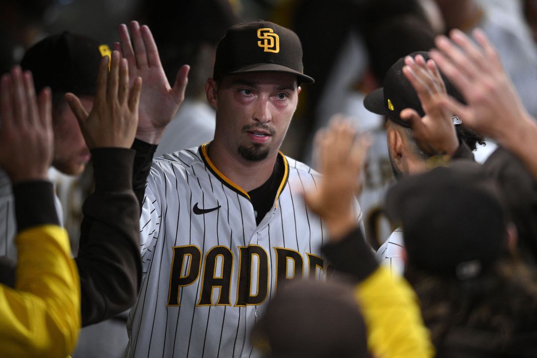 San Diego Padres starting pitcher Blake Snell (4) is greeted in the dugout after completing the top of the seventh inning against the St. Louis Cardinals at Petco Park; San Diego, California on Sept 21, 2022.