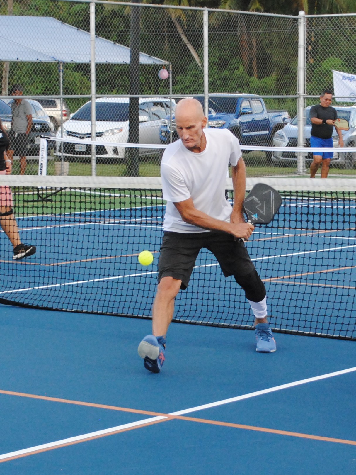 “King of the Court” Donn Dunlop reaches in for the backhand return.
