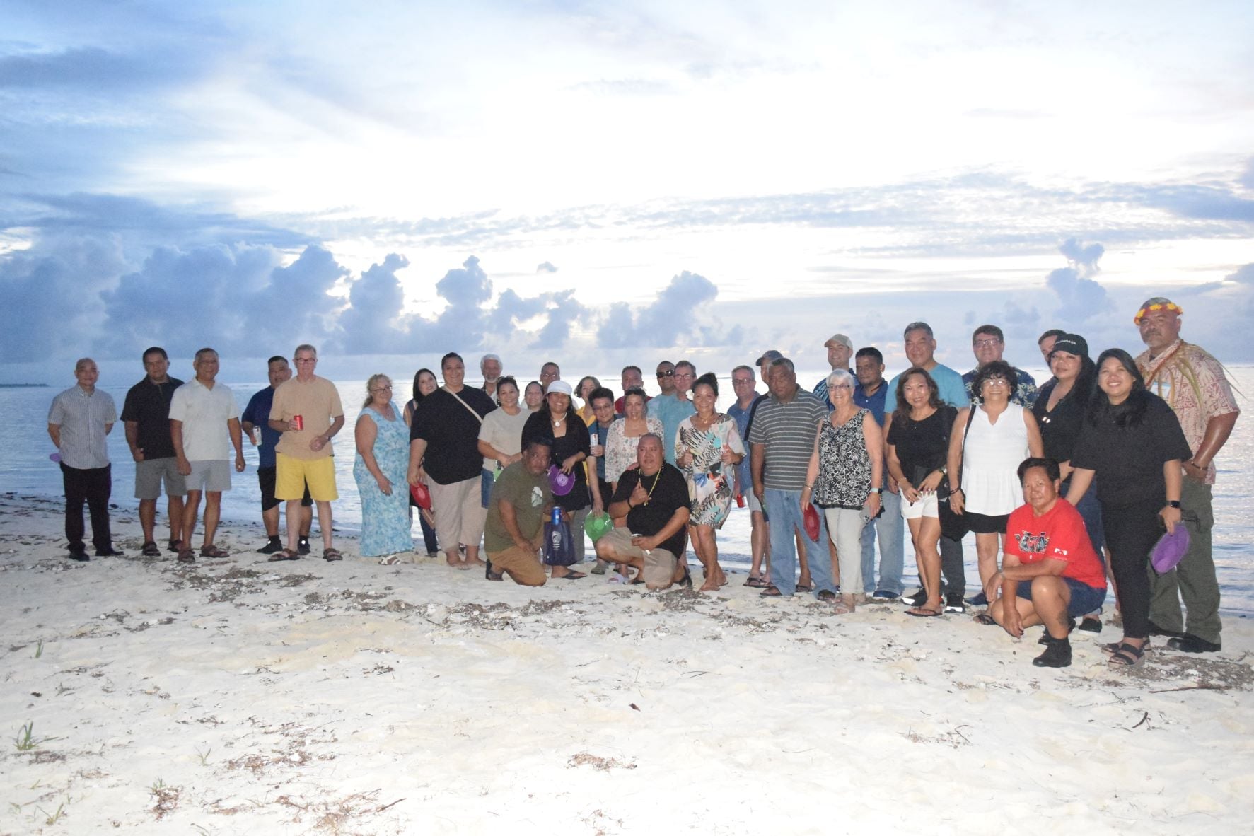 Commonwealth Ports Authority Board Chair Kimberlyn King-Hinds, Executive Director Christopher Tenorio and other CPA officials pose for  photo with officers of the Association of Pacific Ports at Laly 4 Beach in Chalan Kanoa Monday night.