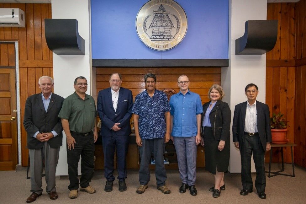 From left, in Palau in August 2022: Dr. Peter Watson; Minister Kaleb Udui; Dr. James K. Galbraith; President Surangel Whipps Jr.; Andrew McLean, chargé d'affaires, ad interim, U.S. Embassy Koror; Dr. Denise Eby Konan; and Dr. Naoyuki Yoshino.
