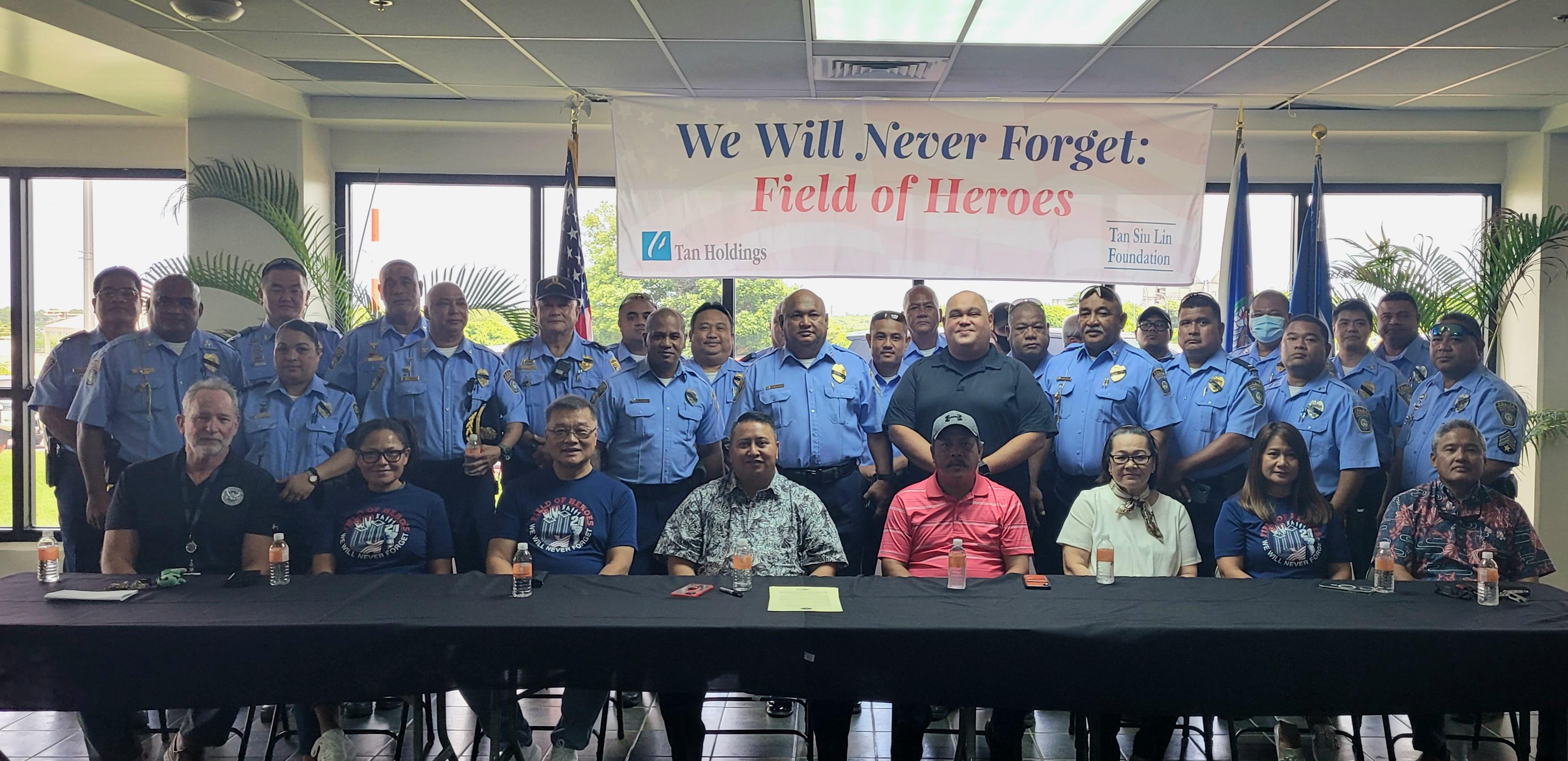 Department of Public Safety officials pose for a photo with government officials and Tan Holdings leadership.