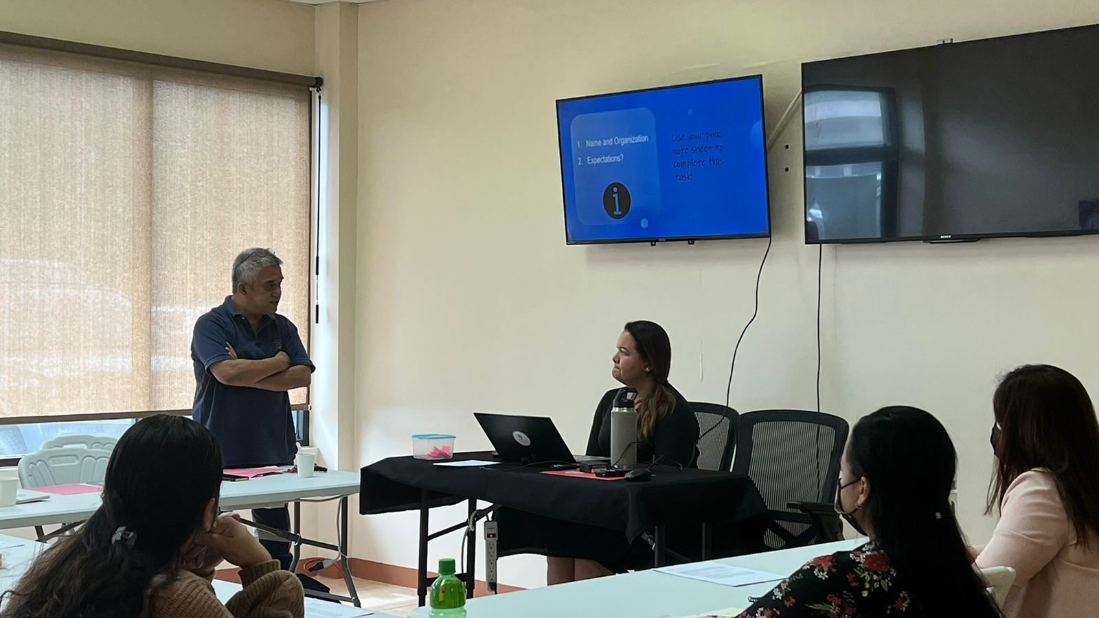 Arnel Gruspe, standing, at one of MANGO's community training sessions on the Nonprofit Toolkit in April.