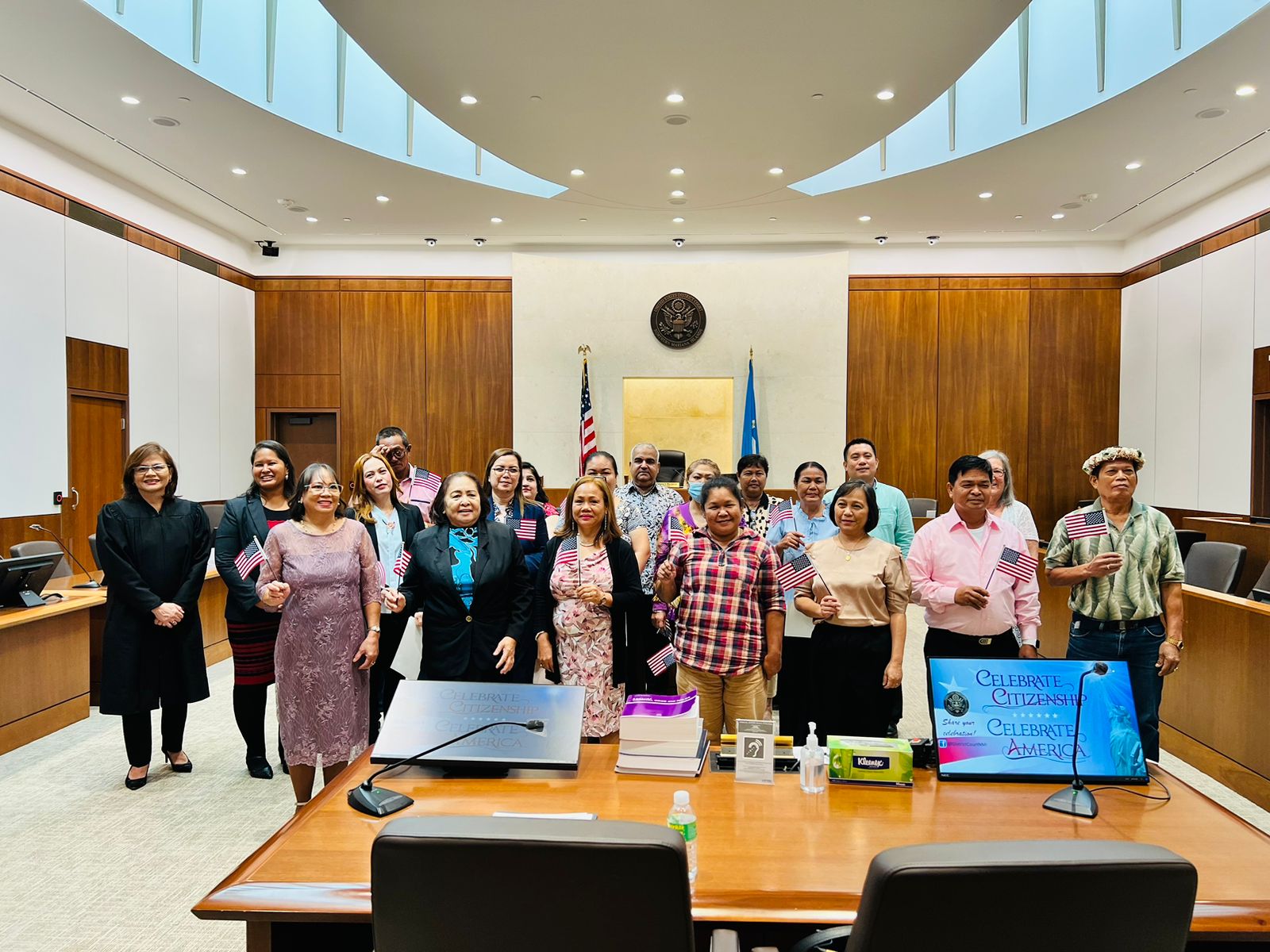 Following a naturalization ceremony in federal court on Monday morning, the new U.S. citizens pose for a photo with Chief Judge Ramona V. Manglona, the guest speaker, Tan Holdings Vice President for Corporate Affairs/ Human Resources Catherine Attao-Toves, and Patricia Phelan, U.S. Citizenship and Immigrations Services officer.