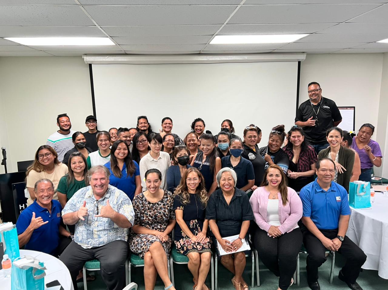 Marianas Tourism Education  Council Acting Chairwoman  Vicky Benavente, seated third right, leads an MTEC orientation for school MY WAVE (Marianas Youth Welcome All Visitors Enthusiastically) club advisors on Sept. 9, 2022, at Hyatt Regency Saipan. Also pictured are other MTEC directors and school MY WAVE Club advisors.