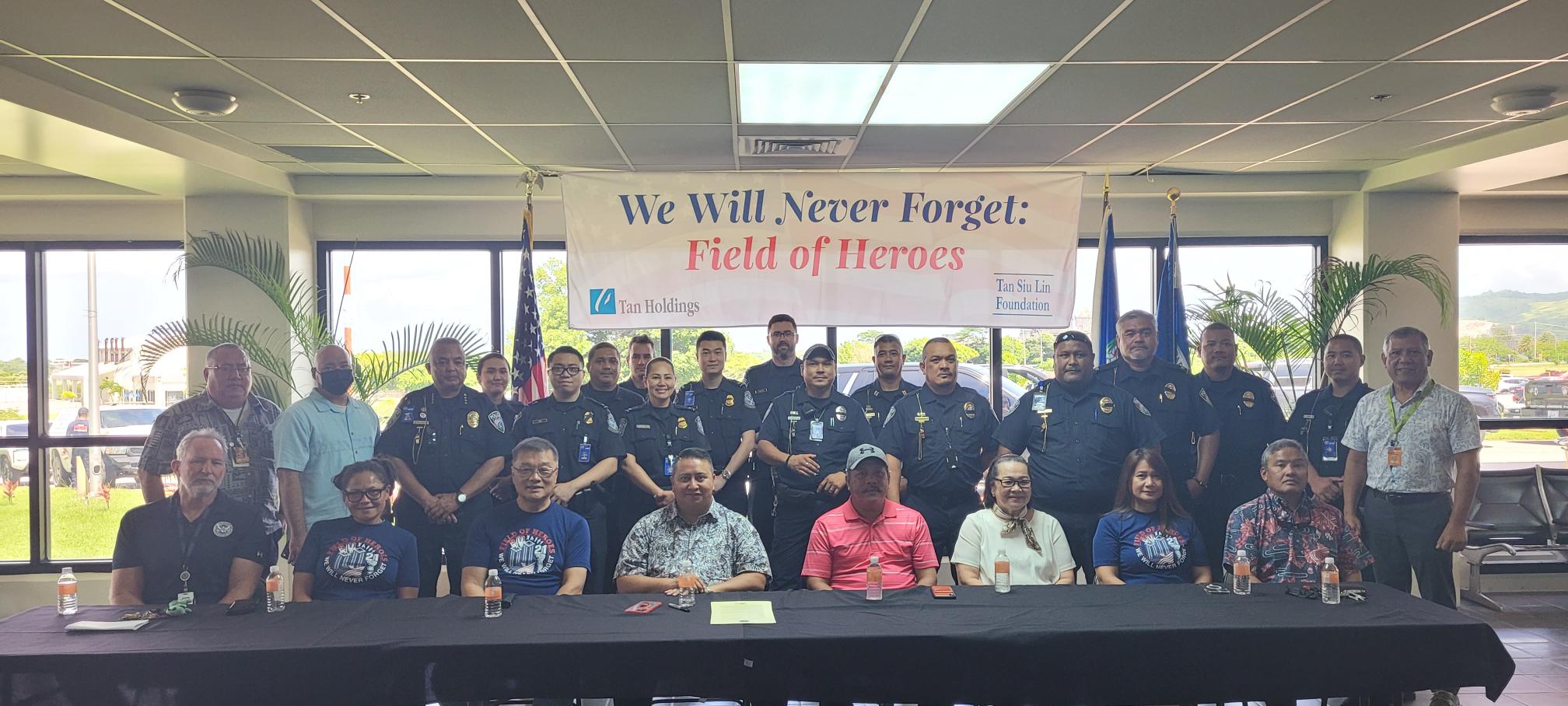 Customs and Border Protection agents and Ports Police officers pose for a photo with officials.