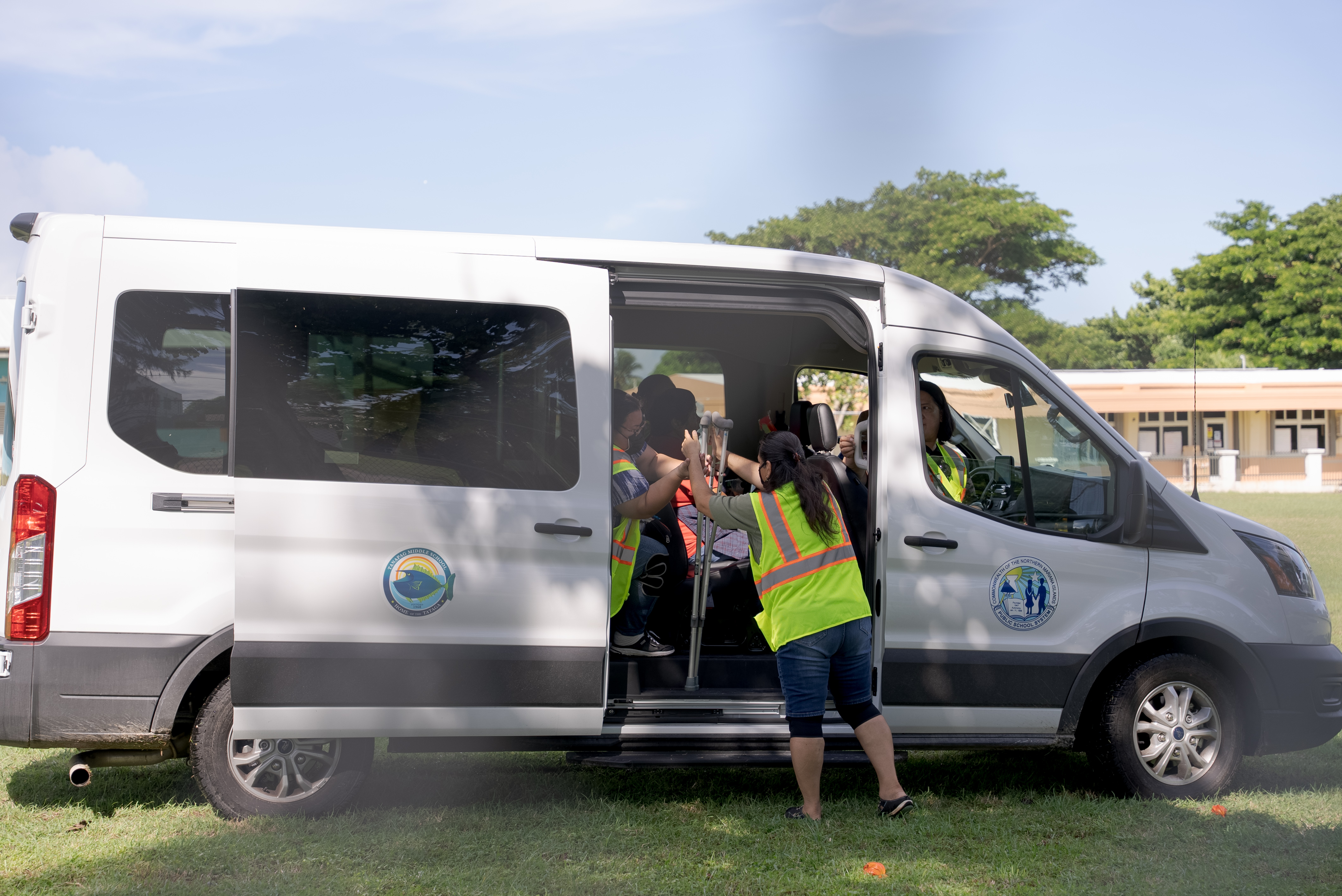 At the Head Start/Early Head Start Center in Tanapag, a PSS van evacuates students with special needs with the support of school and Office of Pupil Transportation personnel.