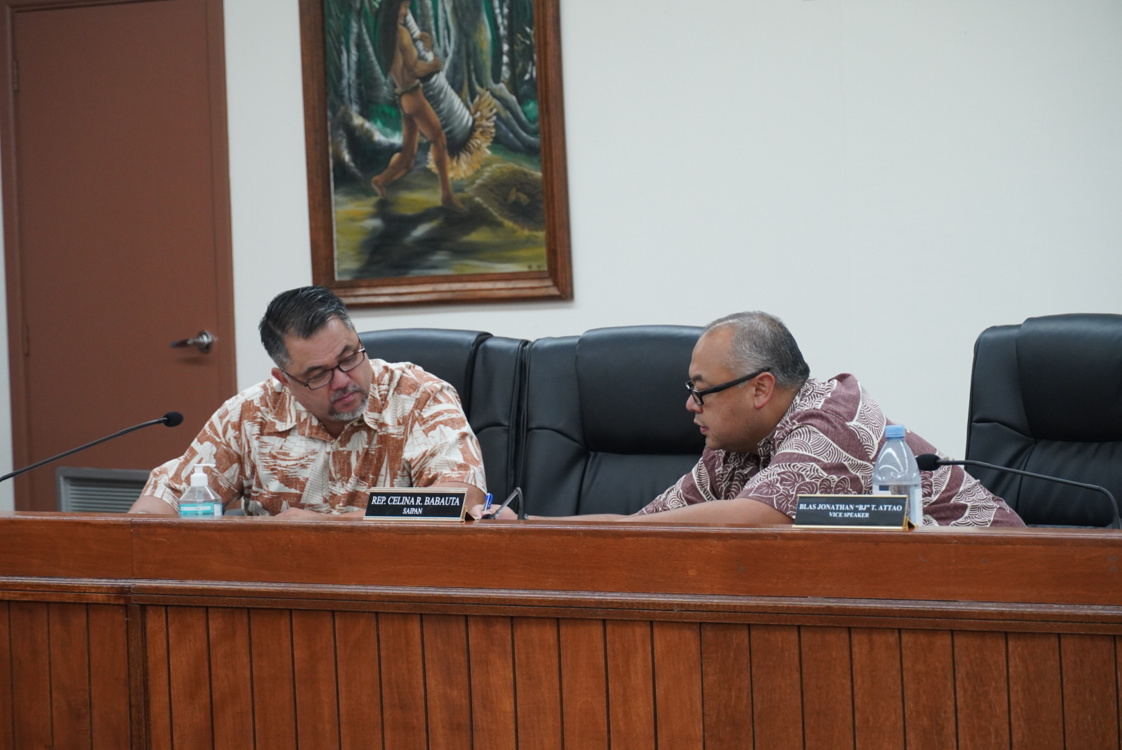 House Vice Speaker Blas Jonathan T. Attao, right, and House Floor Leader Ralph N. Yumul, left, review documents prior to the conference committee meeting on Thursday afternoon in the Senate chamber.
