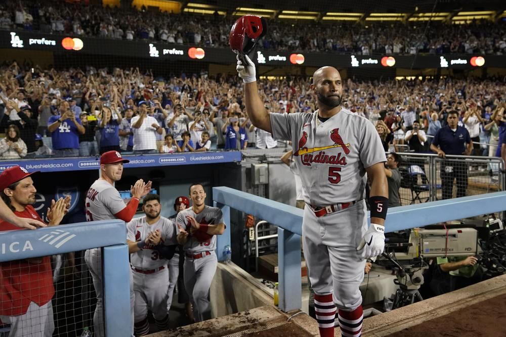 St. Louis Cardinals designated hitter Albert Pujols (5) celebrates after hitting a home run during the fourth inning of a baseball game against the Los Angeles Dodgers in Los Angeles, Friday.
