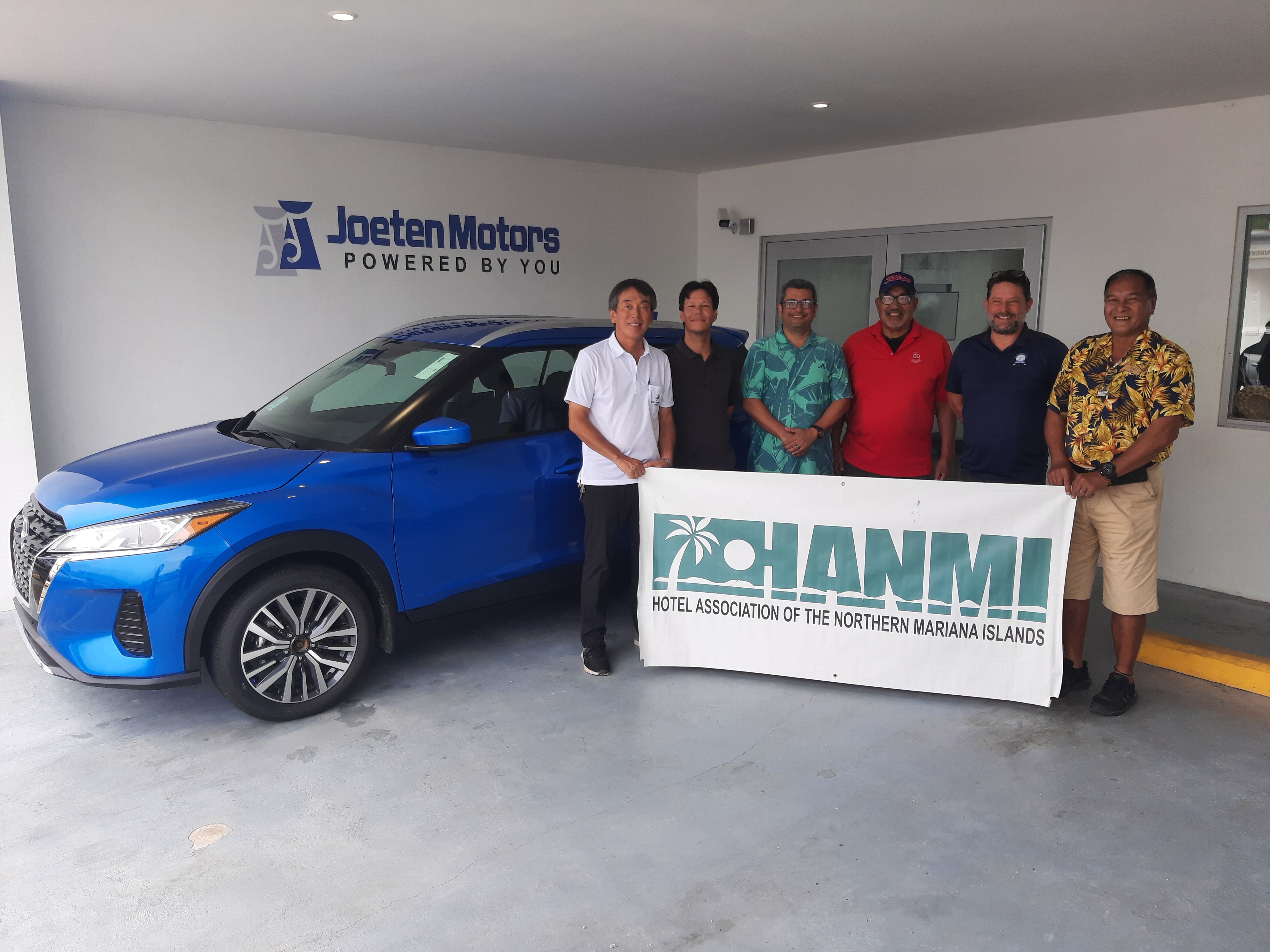 Joeten Motors General Manager Matthew Deets, second right, presents a 2022 Nissan Kicks on Aug. 31, 2022, in San Jose, Saipan, as a hole-in-one prize for the 20th Annual HANMI Charity Classic Golf Tournament to be held on Sept. 17, 2022 at LaoLao Bay Golf & Resort.  From left, tournament committee chairman Juko Ishikawa, Joeten Motors Operations Manager Peter Tenorio and Sales Manager Ray Alvarez, tournament committee member Tony Satur, Deets, and tournament committee member Max Concepcion.