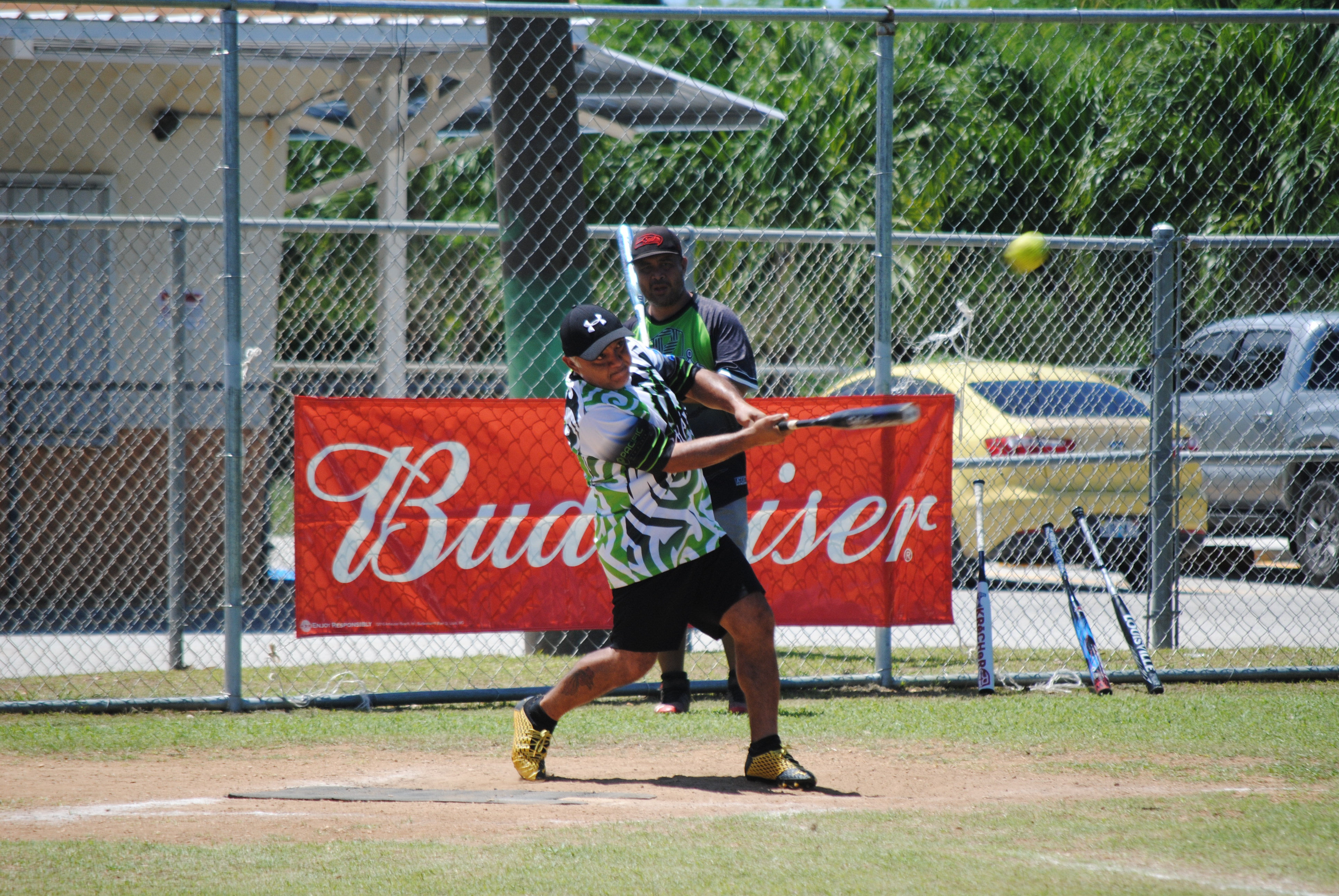 Takohao's Alvin Takai connects a single during a 2022 Budweiser Belau Amateur Softball League game at the Dandan baseball field.