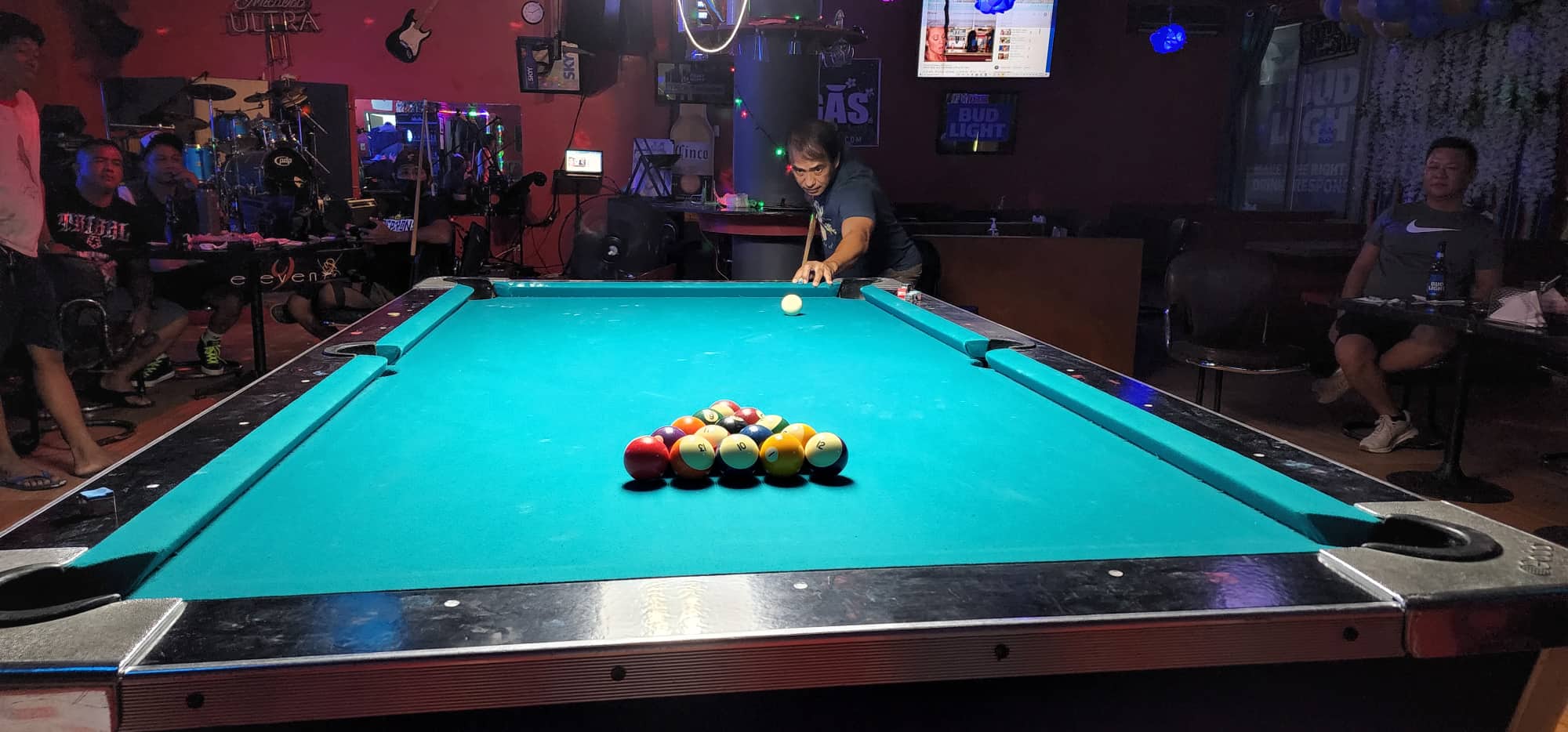 SCS Just Chillin's Rowel "Cobra" Mariano lines up for the break during a Tuesday Division game of the SBA Budweiser Open 8-Ball League at 9 Eleven Restobar.