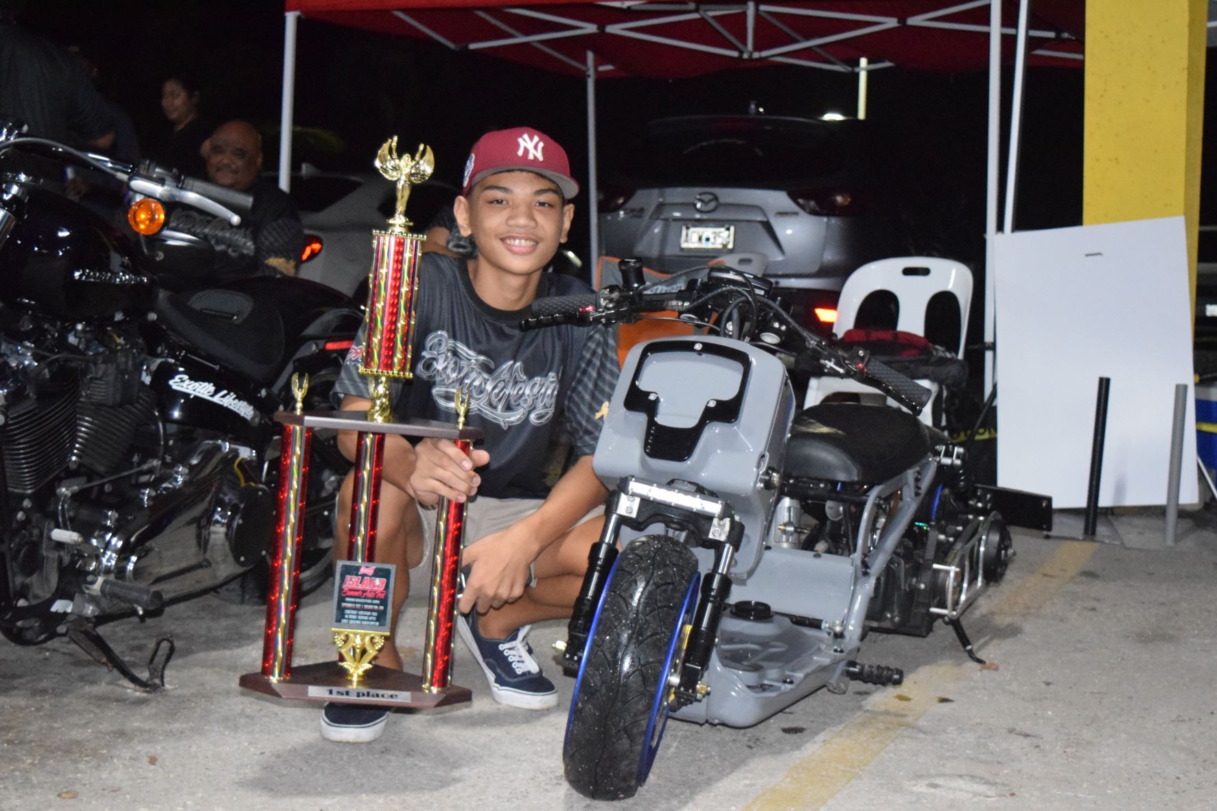 JT Ada and his 2004 Honda Ruckus won first place in the scooter category.