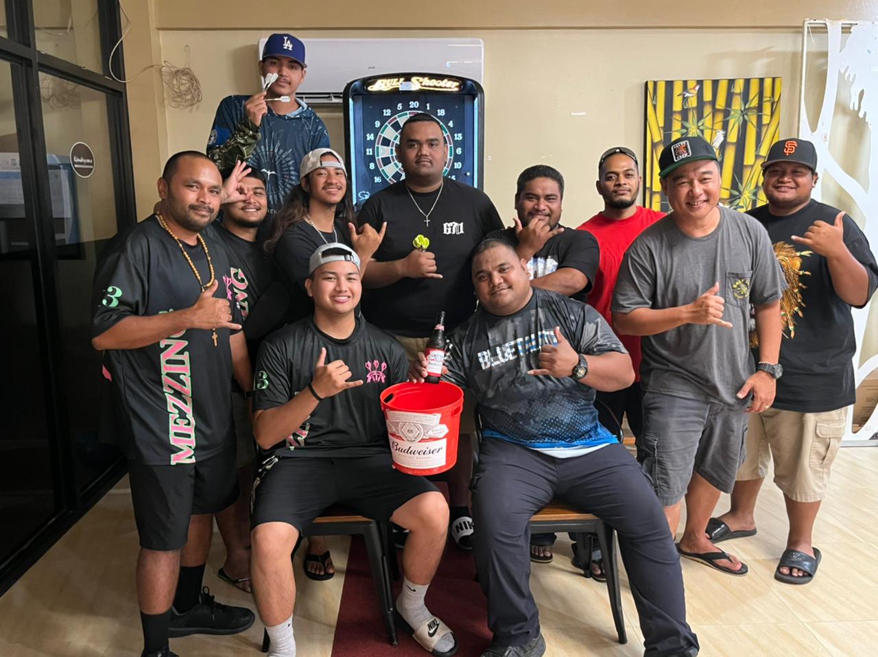 Rendezvous Mezzing and 9 Eleven ONLY-FAMZ pose for a photo after their match Wednesday in the “C” Division of the SEDA Bud Light Dart League at Rendezvous Restaurant.