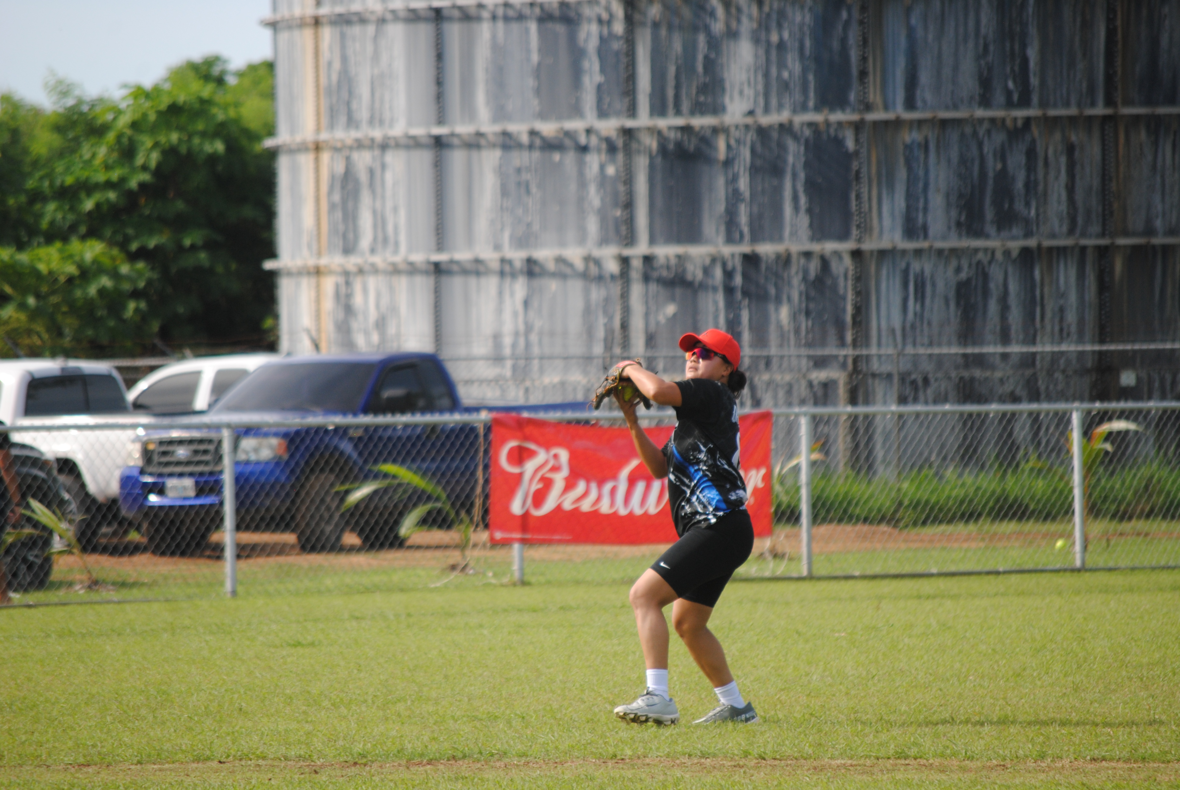 670 Babes shortstop Cat Dela Cruz gathers for the throw to first base during a 2022 Budweiser Belau Softball Amateur League game Sunday at the Dandan baseball field.