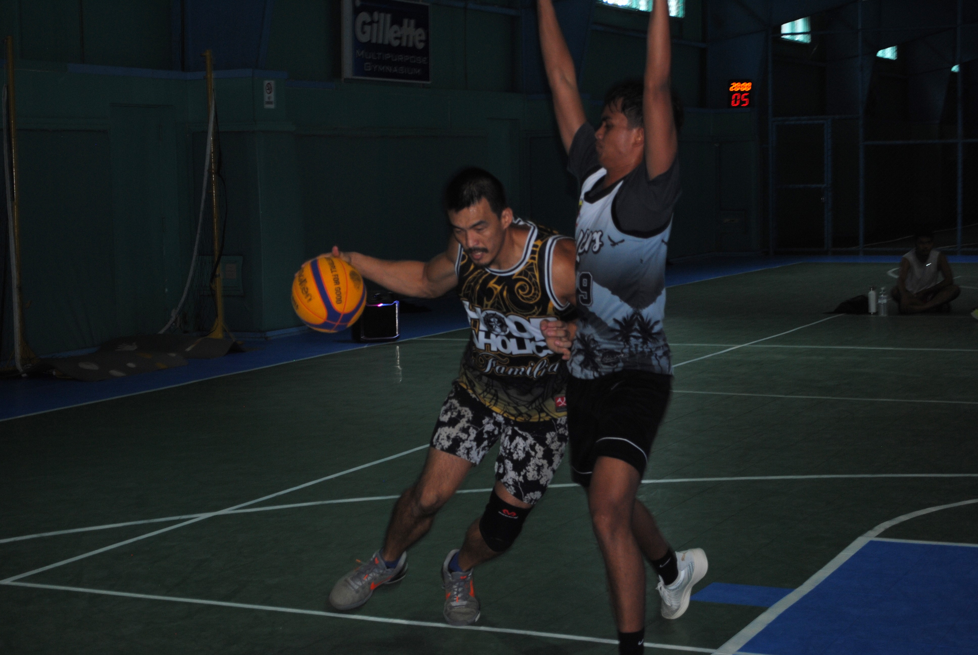 James Lee attempts the drive as a defender closes in.
