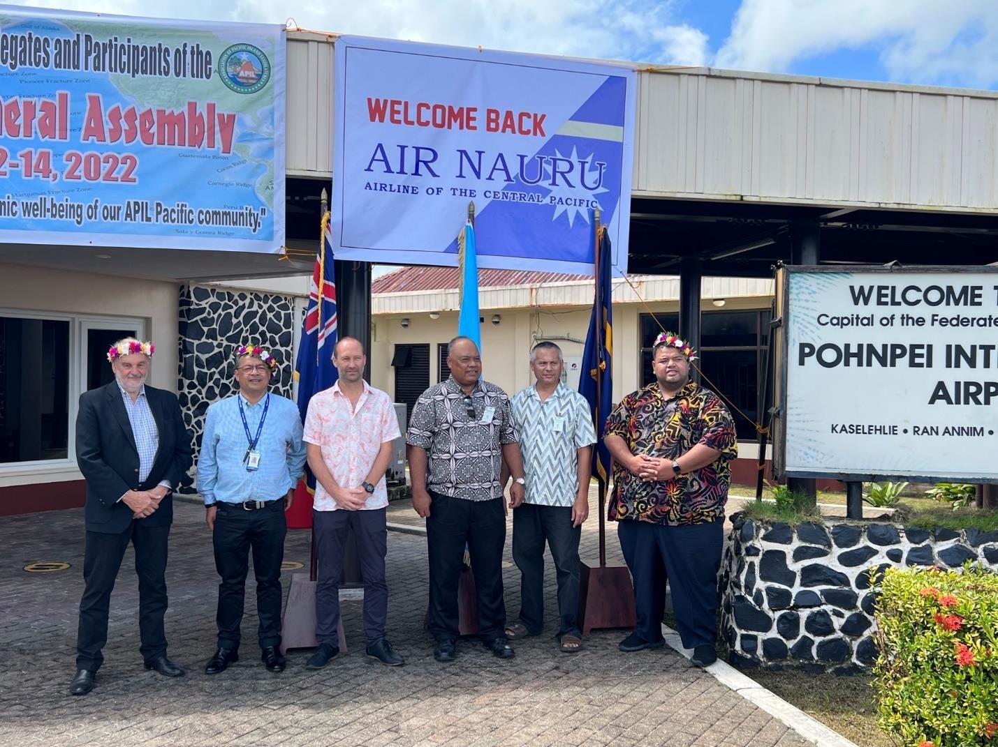 FSM Secretary of Foreign Affairs Kandhi Elieisar and acting  Transportation Secretary Thomas Kostka  pose with the delegation from Nauru.