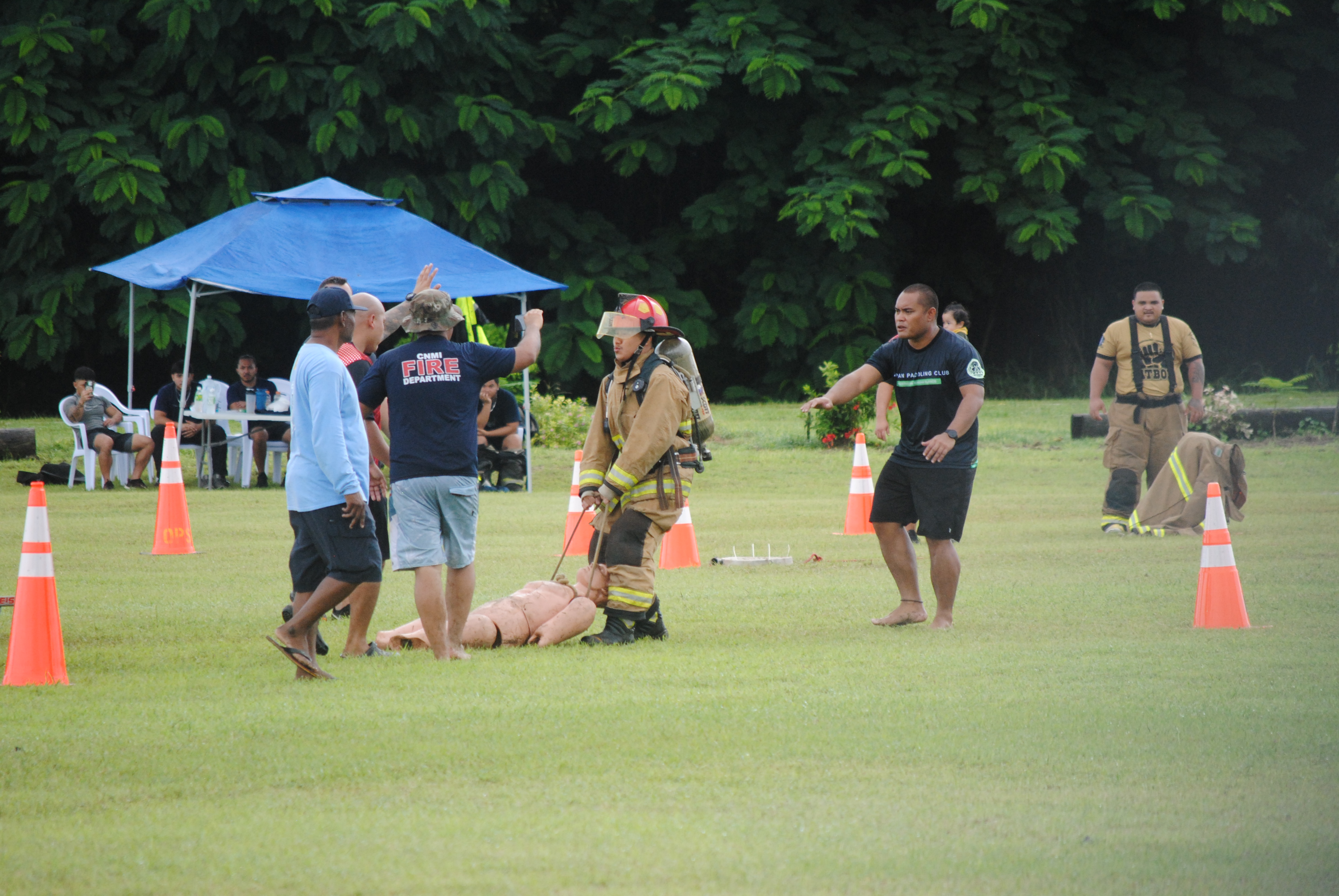A participant drags a mannequin during the Saipan Muster Challenge at the Airport Field on Saturday.