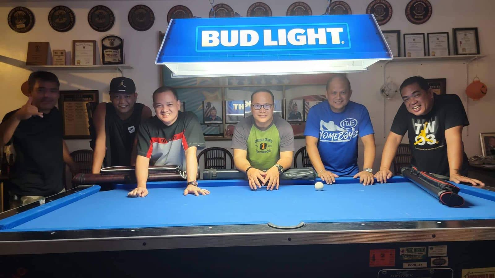 The VFW IT&E Destroyers pose for a photo after the Tuesday Division title game of the SBA Budweiser Open 8-Ball League Tuesday at the VFW Bar.