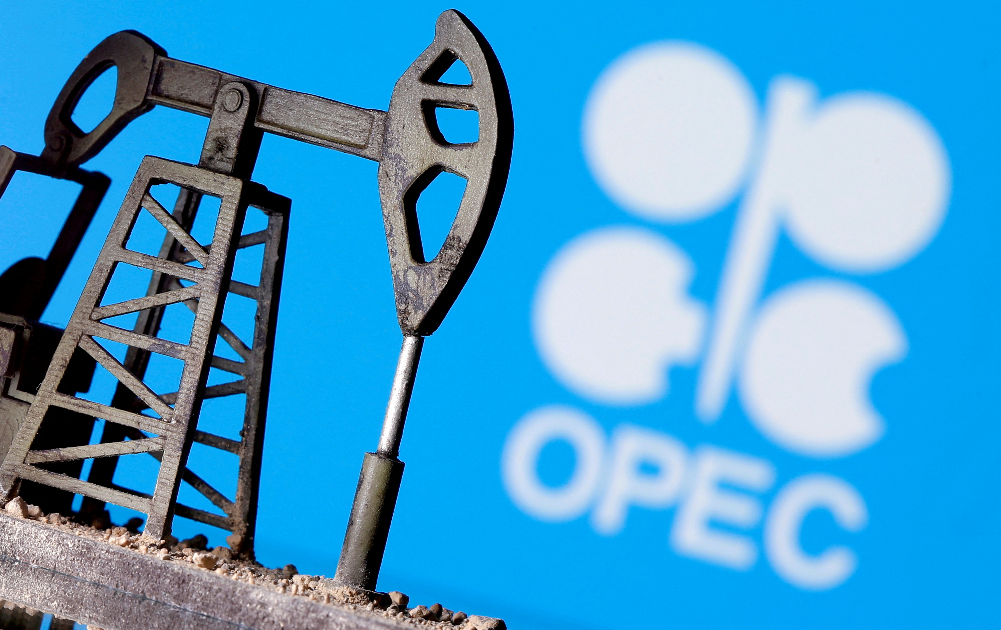 A 3D-printed oil pump jack is seen in front of displayed OPEC logo in this illustration picture, April 14, 2020.
