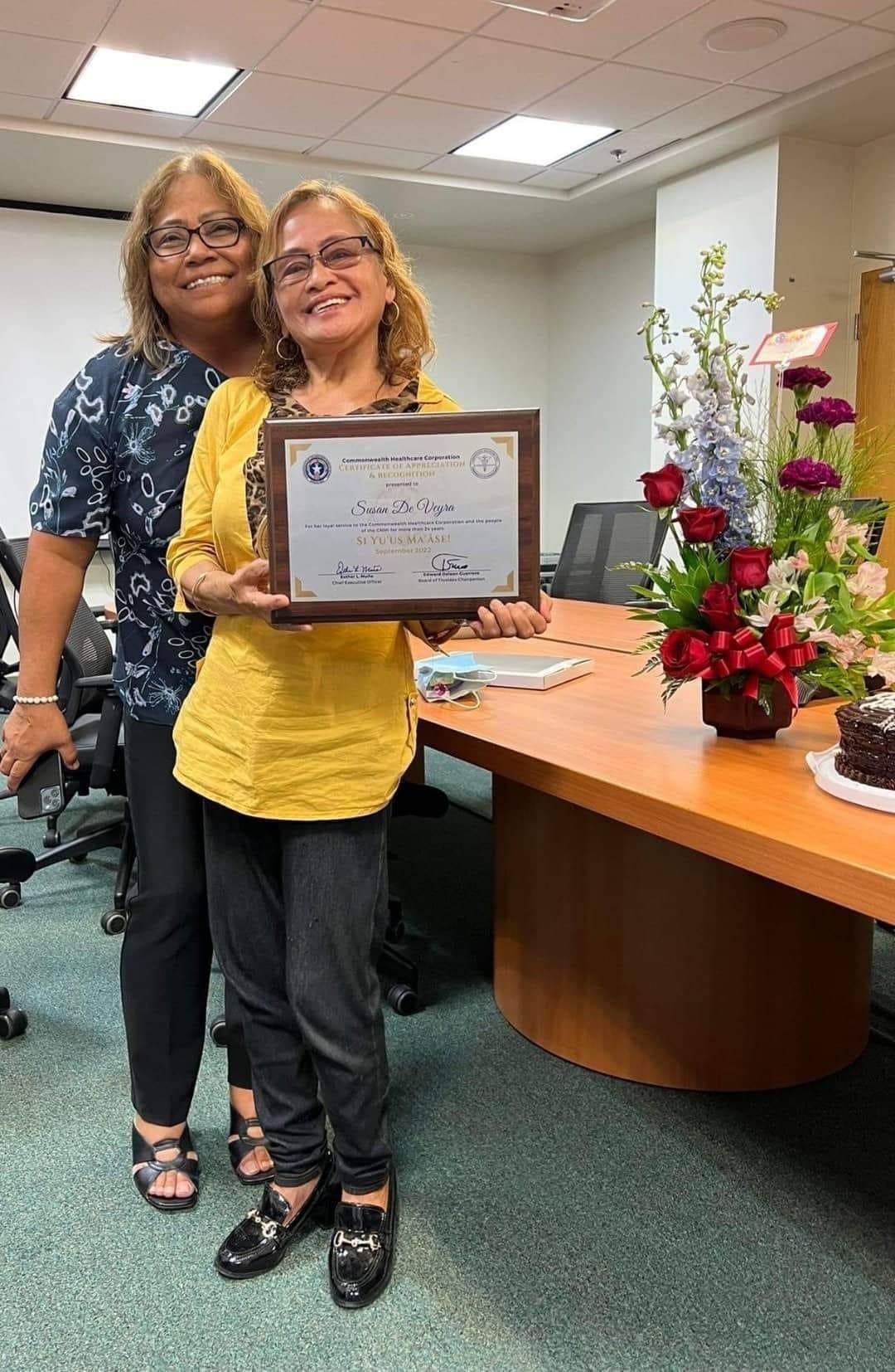 Susan de Veyra, right, with Commonwealth Healthcare Corp. Chief Executive Officer Esther Muna.