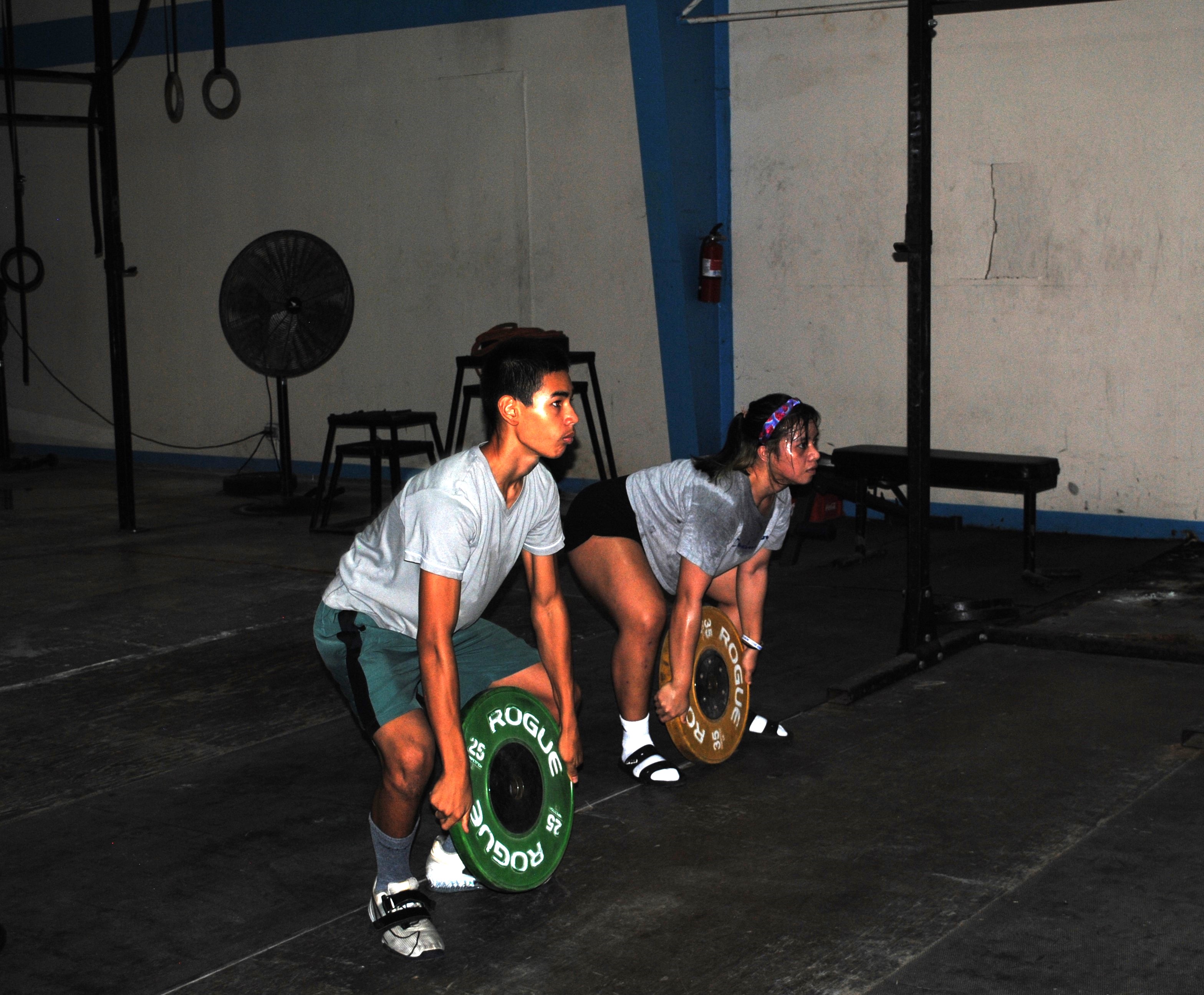 Duane Danford and Anniegail Manuel participate in a training session at the GetFitCNMI gym.