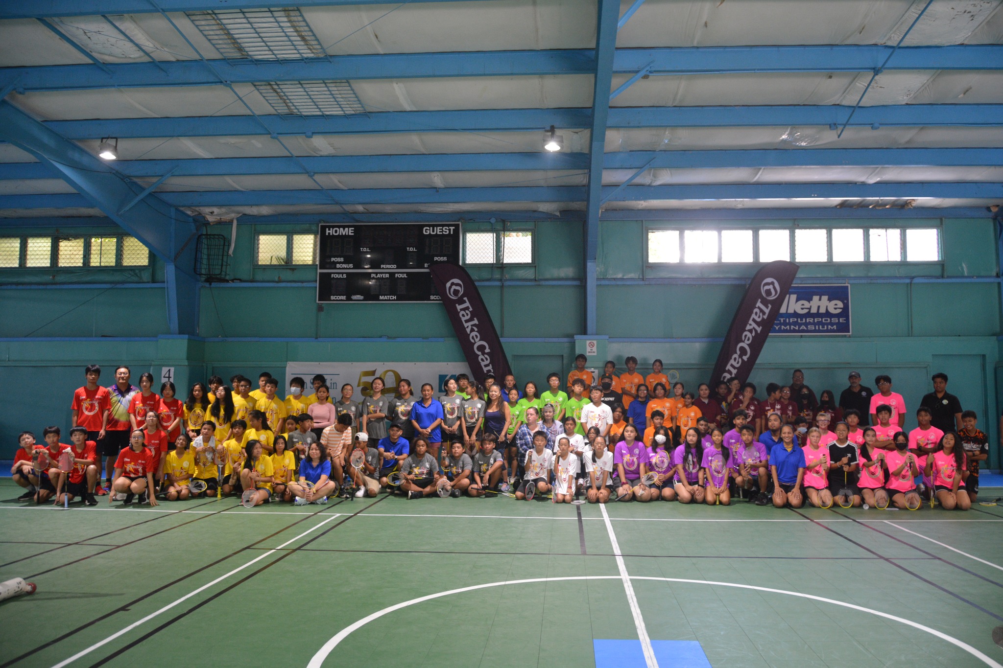 The players pose for a photo on the first day of the NMBF-PSS Co-ed Middle School Badminton League tournament at the TSL Sports Complex on Saturday.