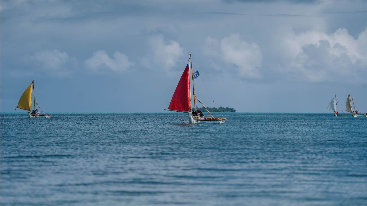 500 Sails aims for the day it can see a horizon full of sails. Pictured here, from left, are canoes Aunty Oba, Richard Seman, Deedee, and Ånimuyi. Managaha is in the background.