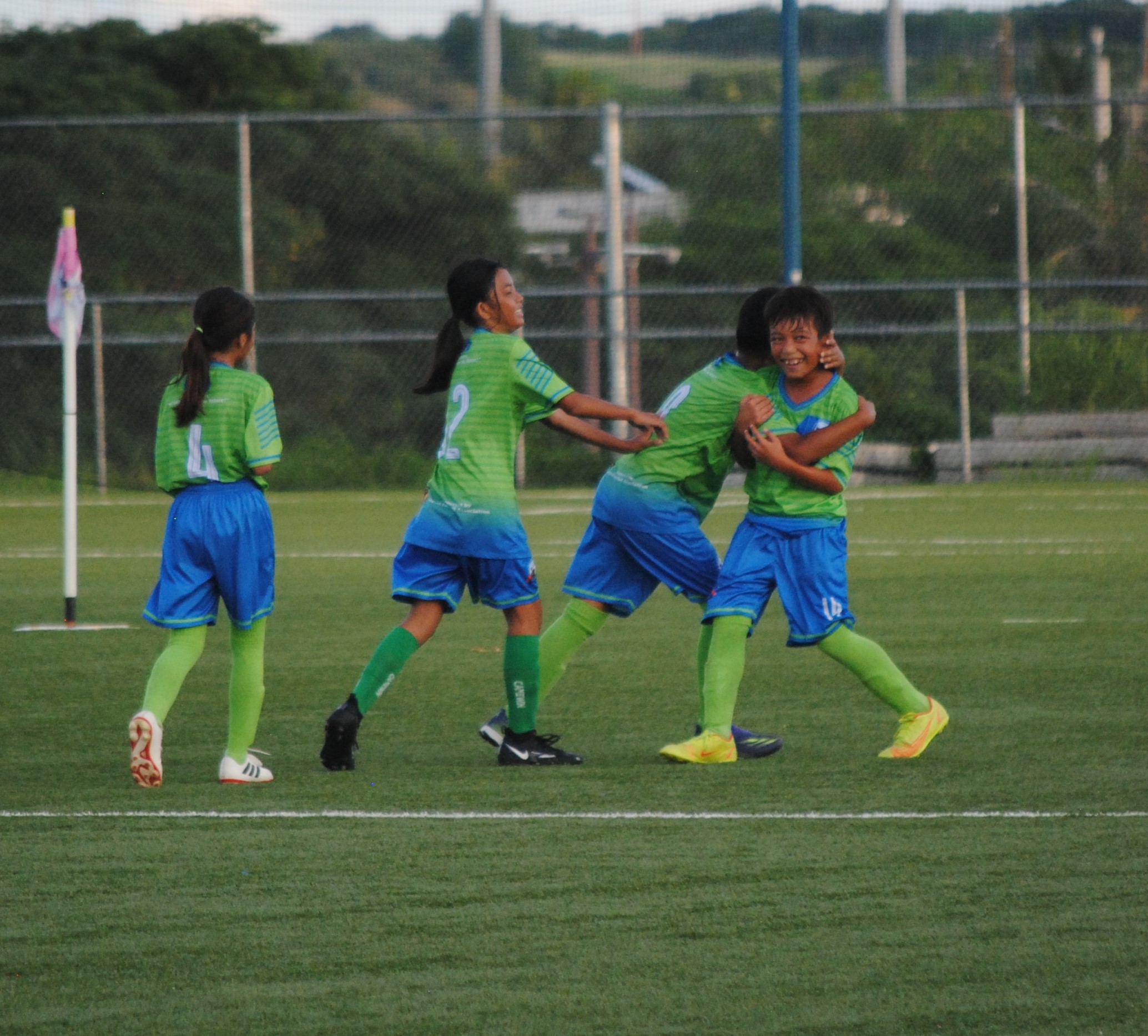 WSR 2 players celebrate after a goal.