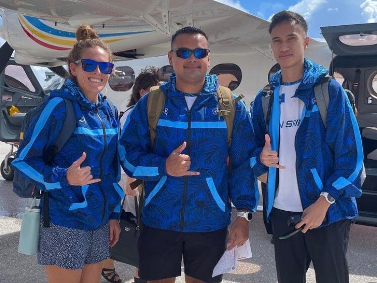 Team NMI's Denise Myers, left, team official Edward Dela Cruz Jr., center, and Sildrey Veloria pose for a photo before boarding a plane to Guam to compete in the 2022 Oceania Cross Country Championships held Saturday at George Washington High School in Mangilao.