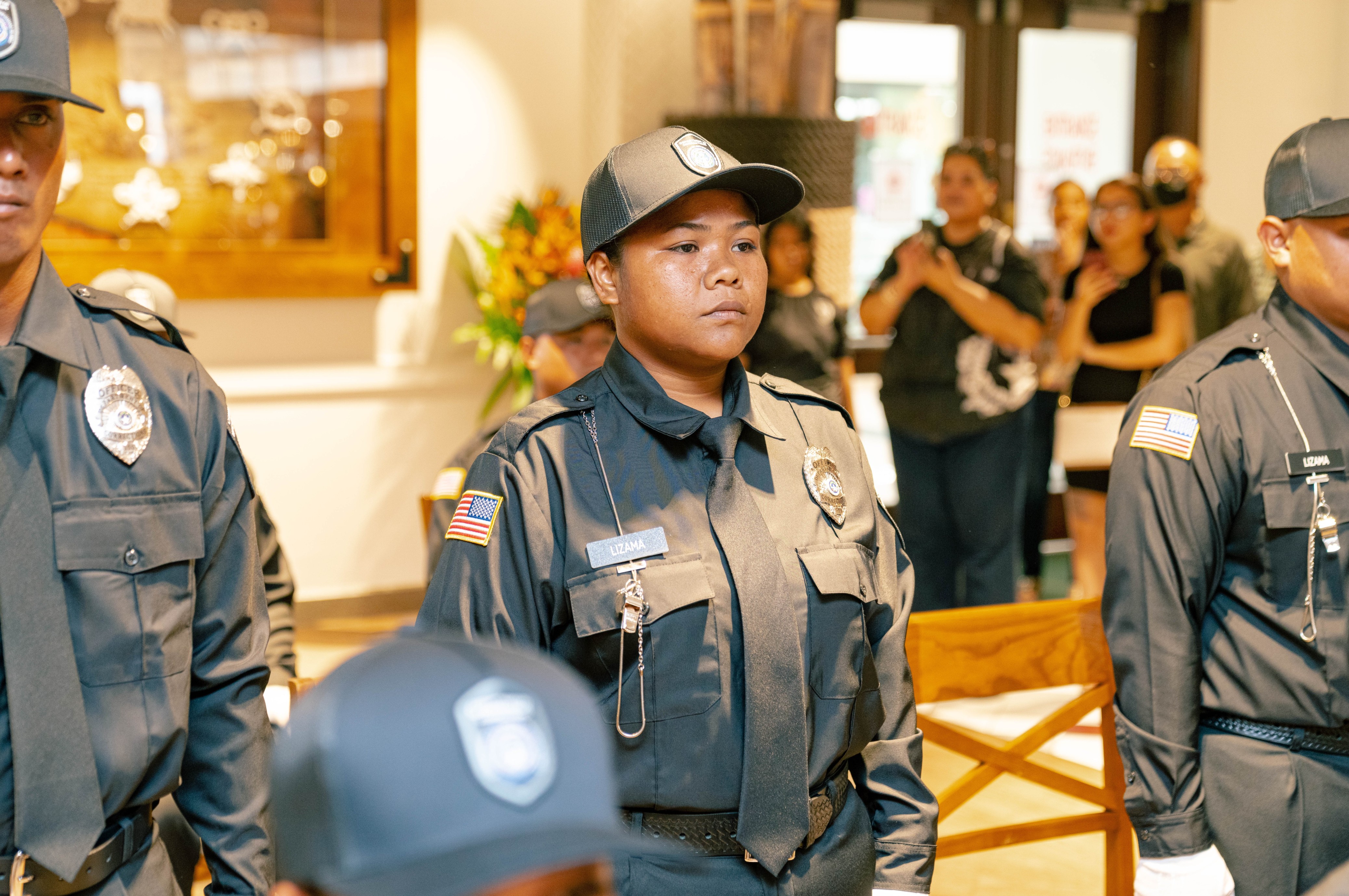 9th Cycle Corrections Academy Valedictorian Johanna K. Lizama stands at attention during the graduation ceremony on Thursday, Oct. 6, 2022 at the Pacific Islands Club.