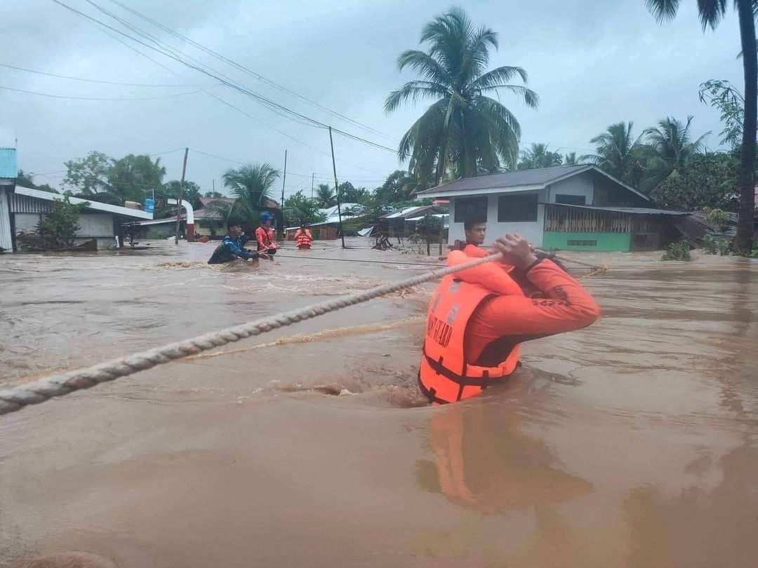 Philippine Coast Guard rescuers evacuate residents from their flooded homes due to Tropical Storm Nalgae, locally named Paeng, in Maguindanao province, the southern Philippines, October 28, 2022.