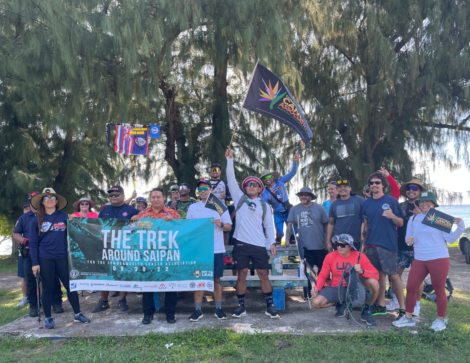 Frank “The Crank” Camacho poses for a photo with Gov. Ralph DLG Torres and other supporters before the start of the Trek Around Saipan for the Commonwealth Cancer Association near PIC on Friday.